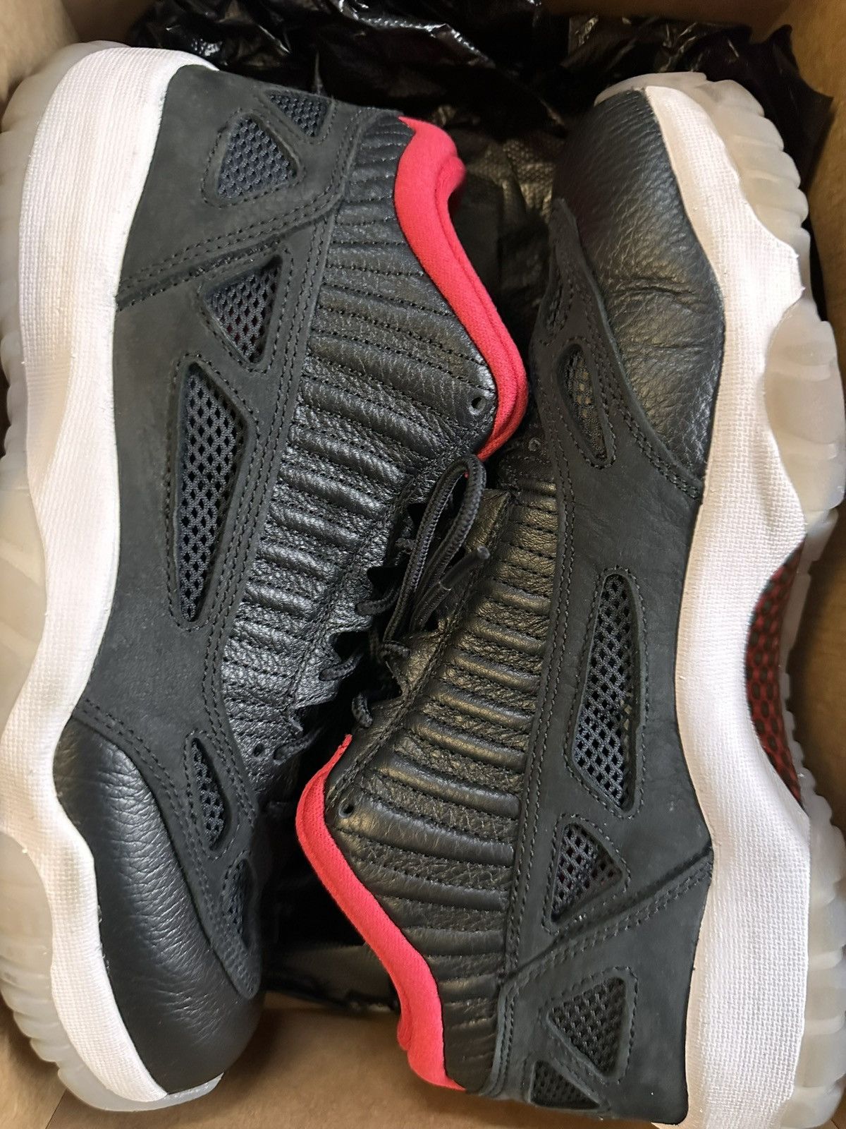 image of Air Jordan 11 Ie Low Shoes in Black, Men's (Size 10)