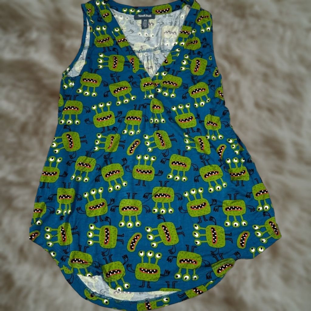 Vintage ModCloth A Welcome Change Sleeveless Tank XS Blue Green 3 Eyed Monster Print Tank Womens XS Blue 3 Eyed Monster Print Size XS / US 0-2 / IT 36-38 - 1 Thumbnail
