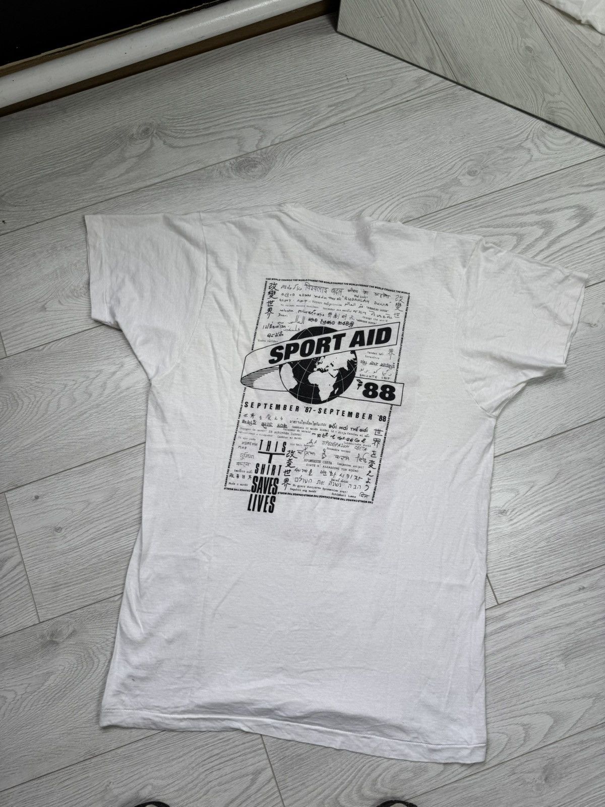 Signal Sport × Vintage 1988 SPORT AID STATUS QUO I CHANGED THE WORLD T-SHIRT (L) Size US XL / EU 56 / 4 - 1 Thumbnail