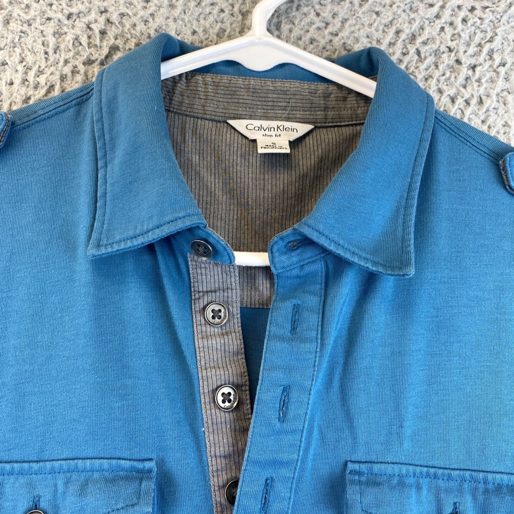 Calvin Klein Calvin Klein Polo Shirt Slim Fit Men’s Indigo 2 Front Pockets Buttoned Sleeves Shoulder Loop Accents 90-68 / 68-90? Size US S / EU 44-46 / 1 - 3 Thumbnail