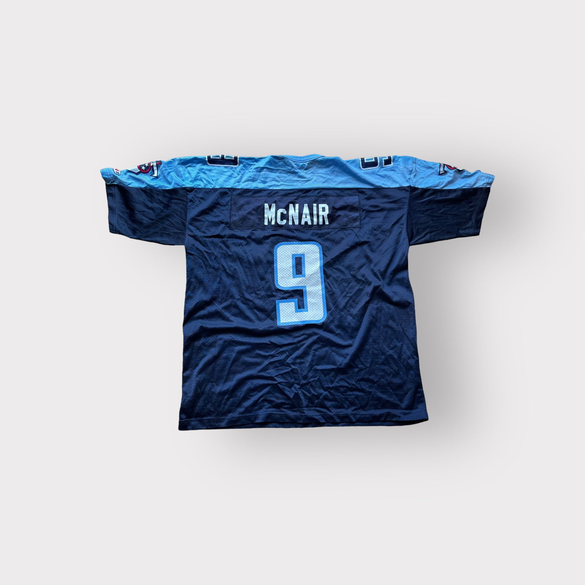 Jim Hardaway wears a Steve McNair jersey as he looks at the