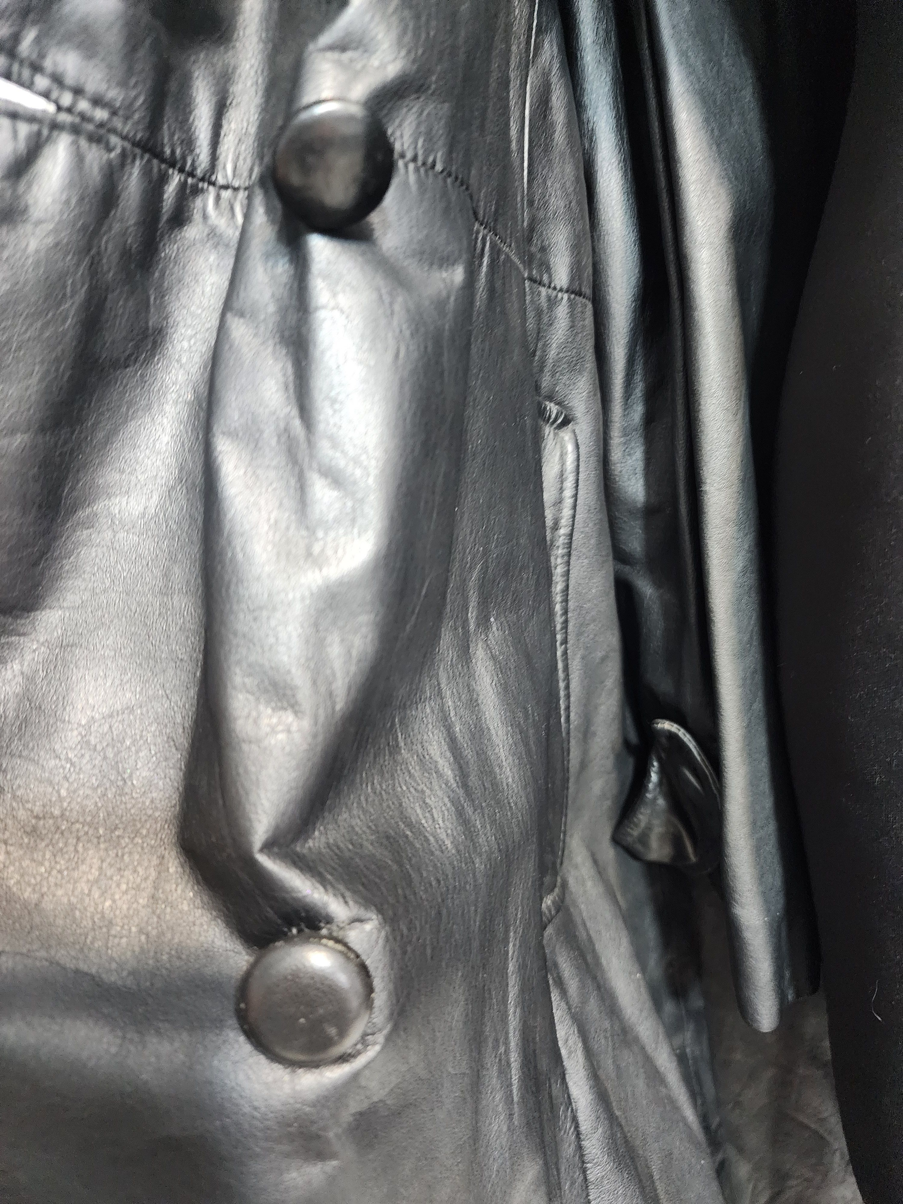 Women black leather raincoat.