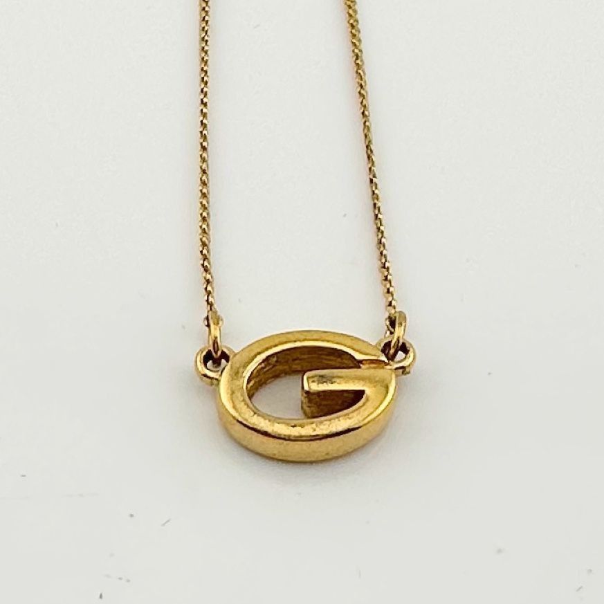image of Vintage Givenchy Oval G Logo Gold Tone Necklace, Women's