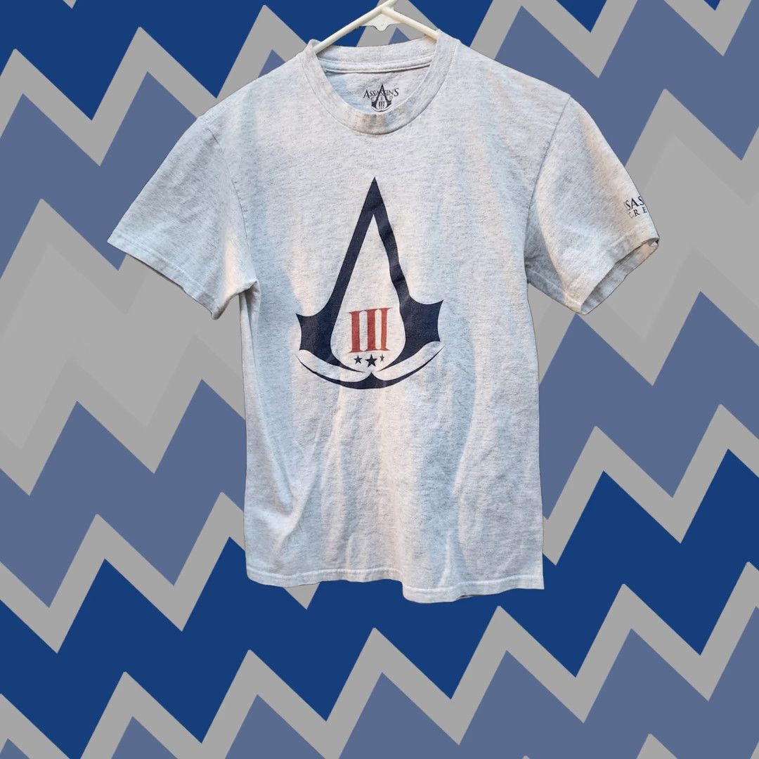 Vintage Ubisoft Assassin's Creed III 2012 Gray Graphic Video Game Promo Tshirt Size S Mens T-Shirt Logo Crew Neck Short Sleeve Cotton Regular Fit Size US S / EU 44-46 / 1 - 1 Thumbnail
