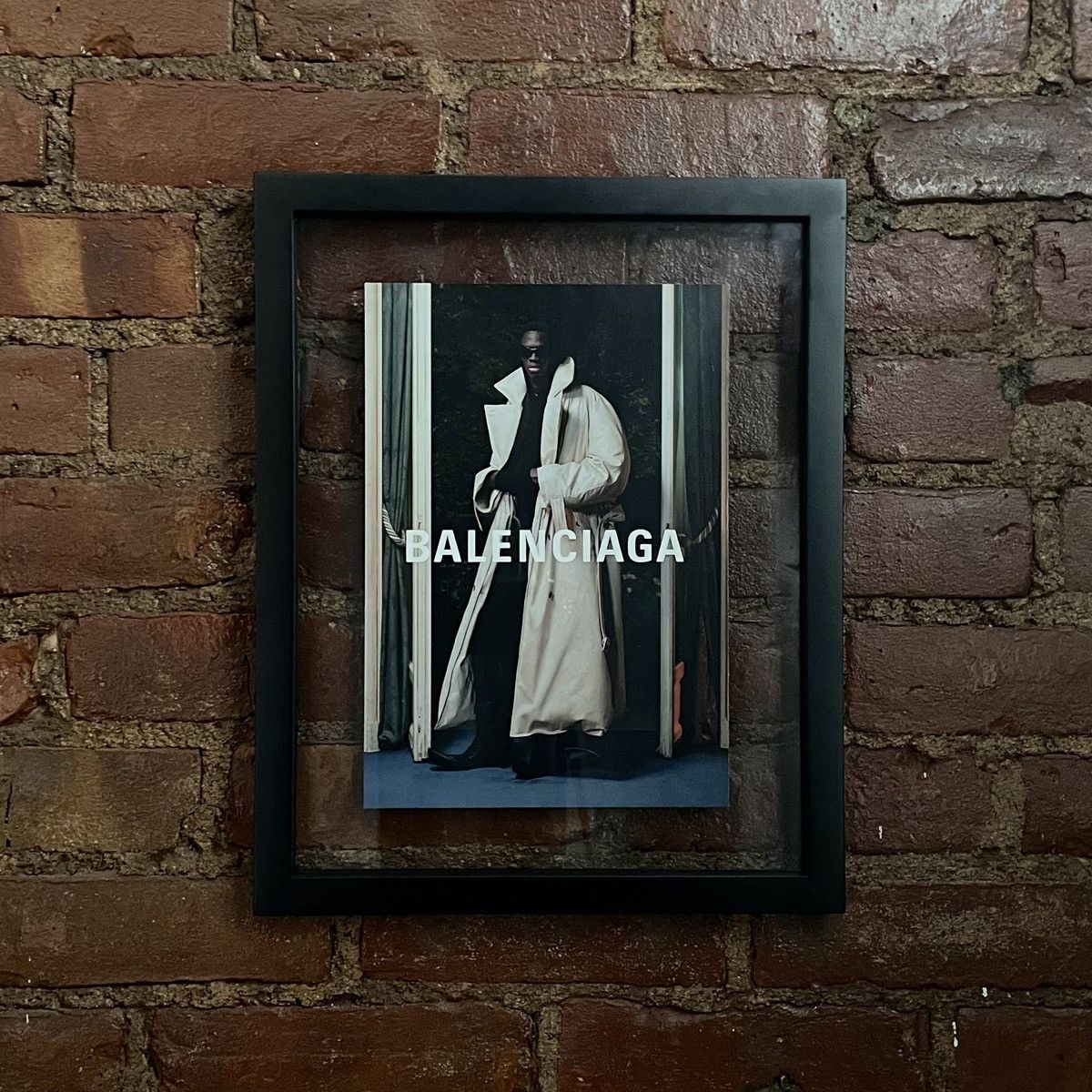 image of Balenciaga Spring ‘24 Maxi Padded Trench Poster in Black, Men's