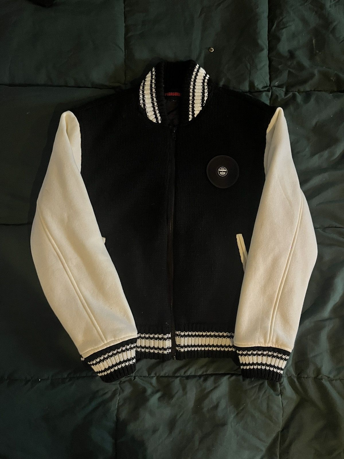 【PLEASURES/プレジャーズ】SMOKE KNITTED VARSITY Pleasures SMOKE KNITTED VARSITY JACKET Black White | BSTN Store