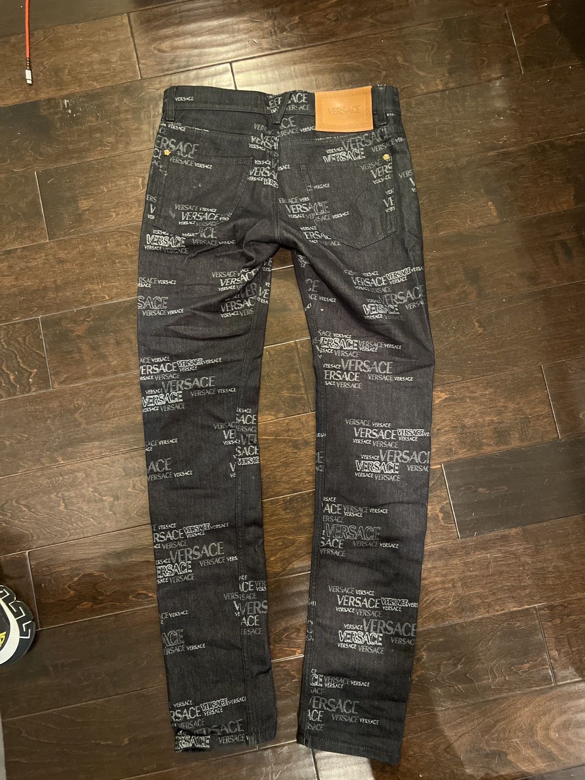 image of Versace All Over Denim Print in Black, Men's (Size 30)