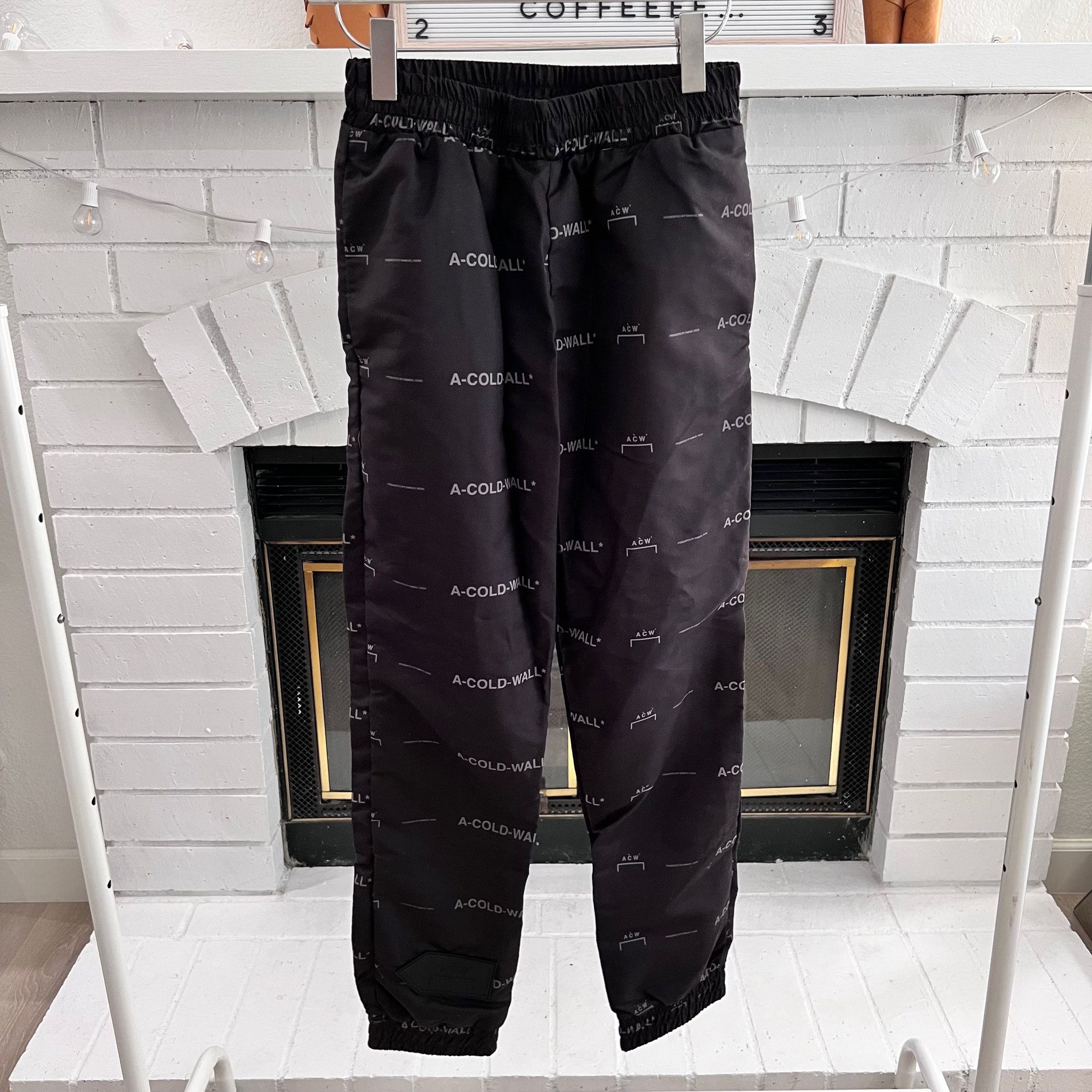 A-COLD-WALL* A-Cold-Wall* Black All-Over Logo Prints Nylon Jogger Pants Size US 30 / EU 46 - 1 Thumbnail