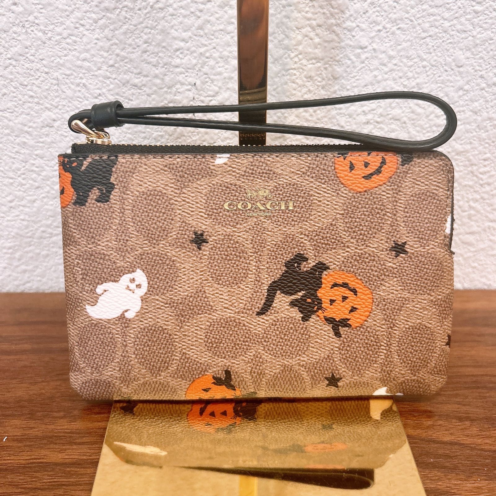 Coach Corner sold Zip Wristlet With Woodstock Print