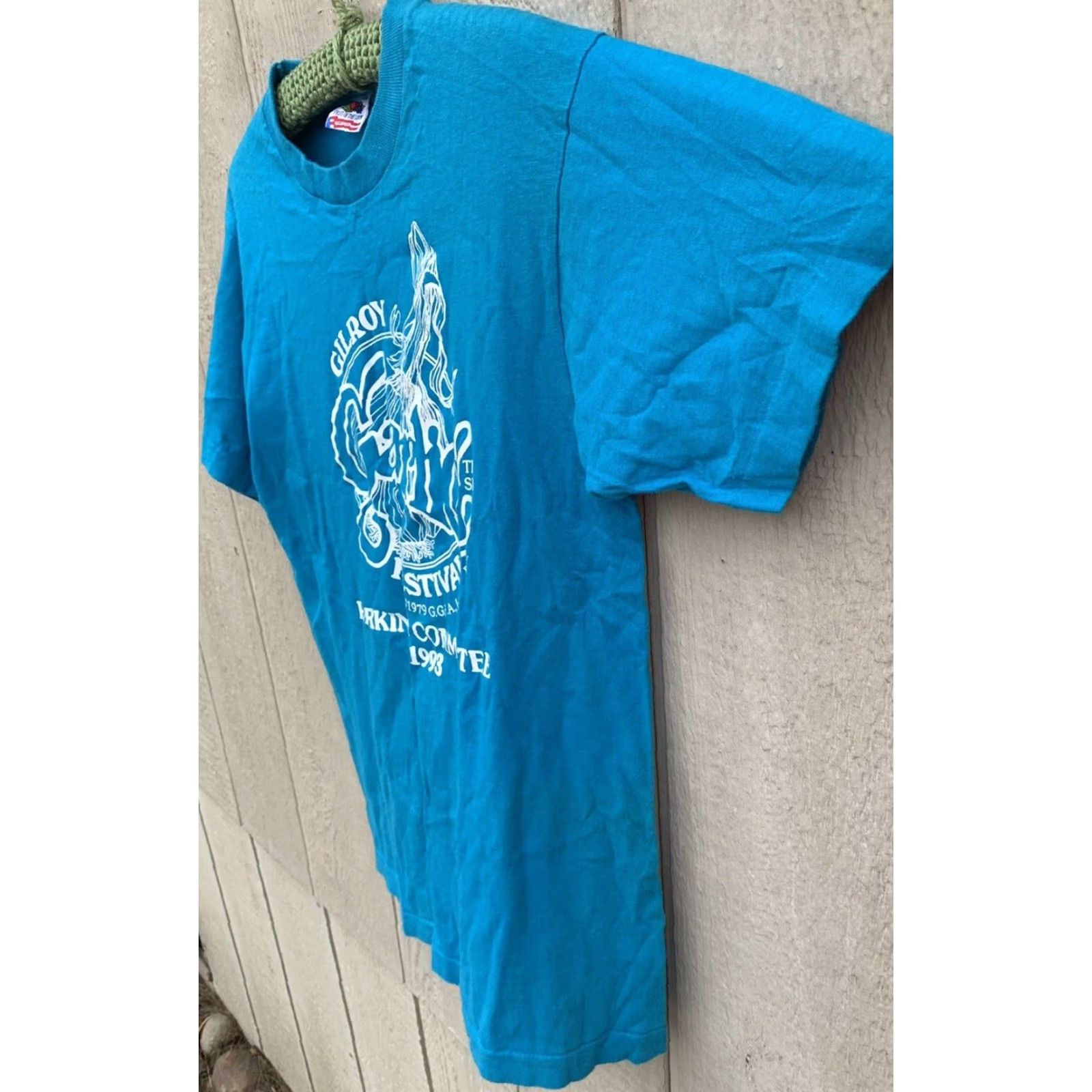 Fruit Of The Loom VINTAGE Gilroy Garlic Festival GGFA Inc Parking Committee 1993 t shirt M blue cotton Men Turquoise Graphics Tee Sportswear/Beach 1990s Shirt Size US M / EU 48-50 / 2 - 6 Thumbnail
