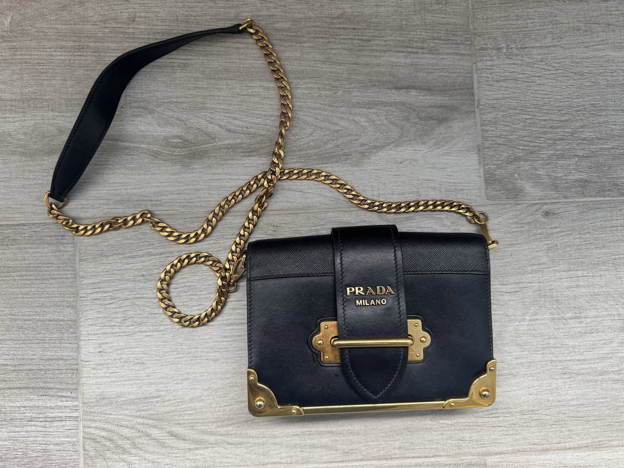 Prada Prada Cahier Leather Shoulder Bag in Black and Gold Size ONE SIZE - 1 Thumbnail