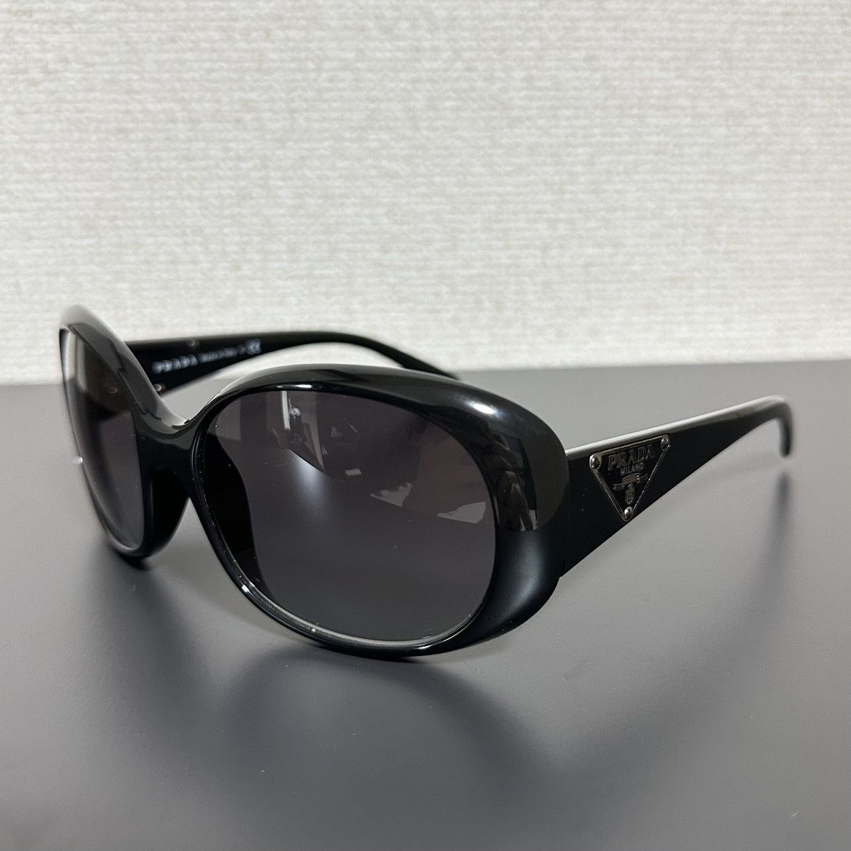 Prada PRADA GEOMETRIC TRIANGLE LOGO SYMBOLE SUNGLASSES | Grailed