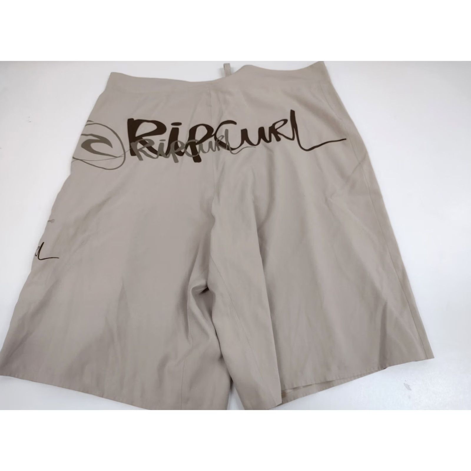 Rip Curl Rip Curl Board Shorts Mens Size 36 Tan Surfing Large Logo #1538 Short Bottom Regular Men Board Shorts Tan Surfing Large Logo 36 Mens Size US 36 / EU 52 - 2 Thumbnail