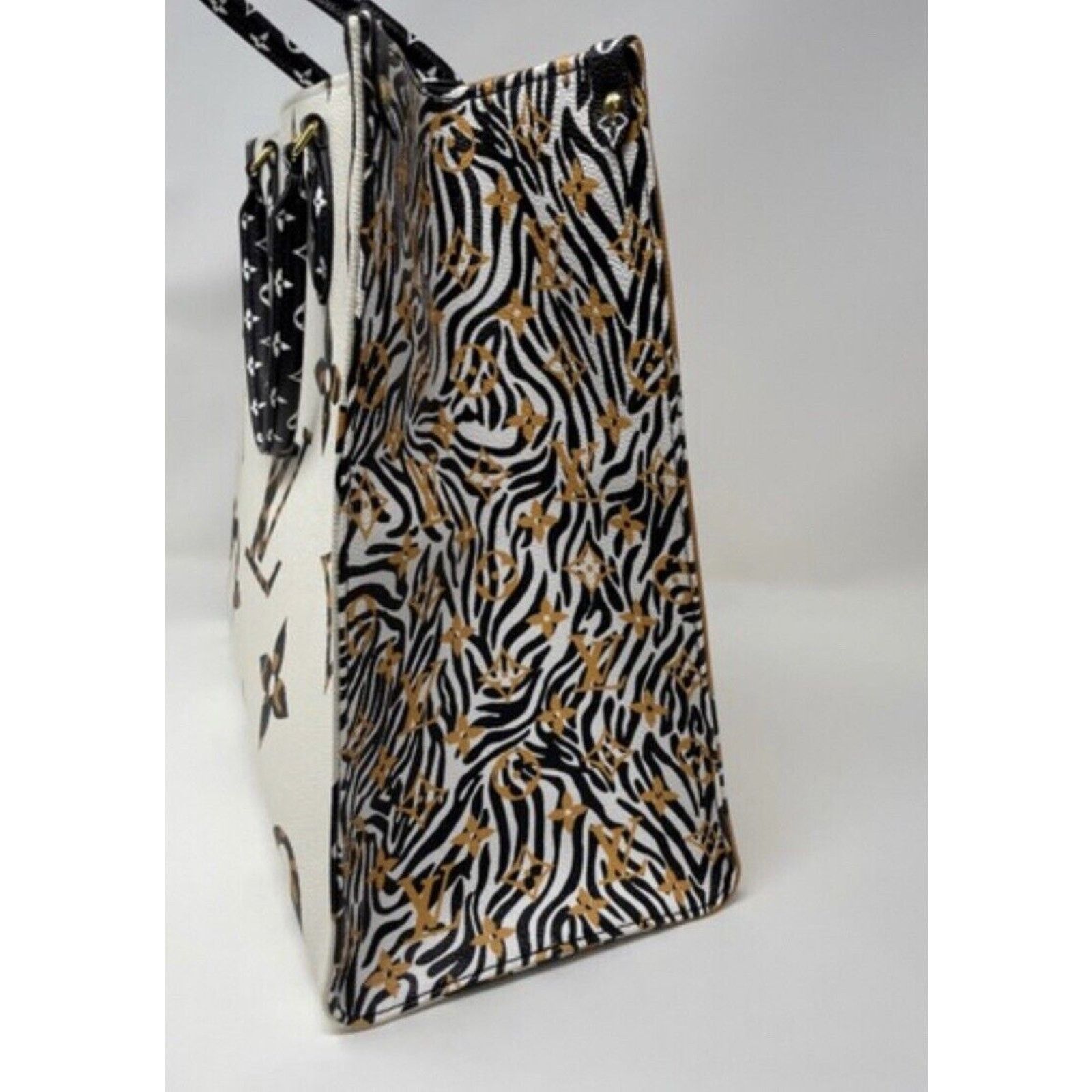Louis Vuitton LOUIS VUITTON ONTHEGO GIANT JUNGLE MONOGRAM IVORY CARAMEL Size ONE SIZE - 8 Thumbnail