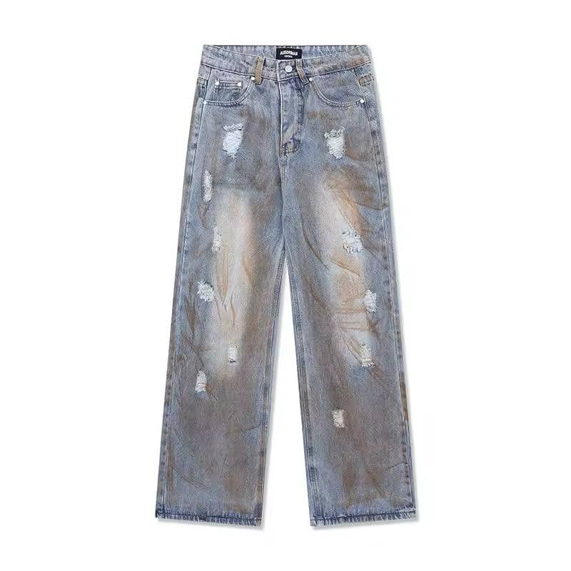 ripped casual jeans in a rust color.