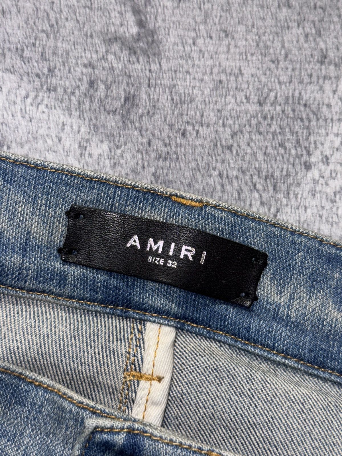 AMIRI BLUE DISTRESSED JEANS