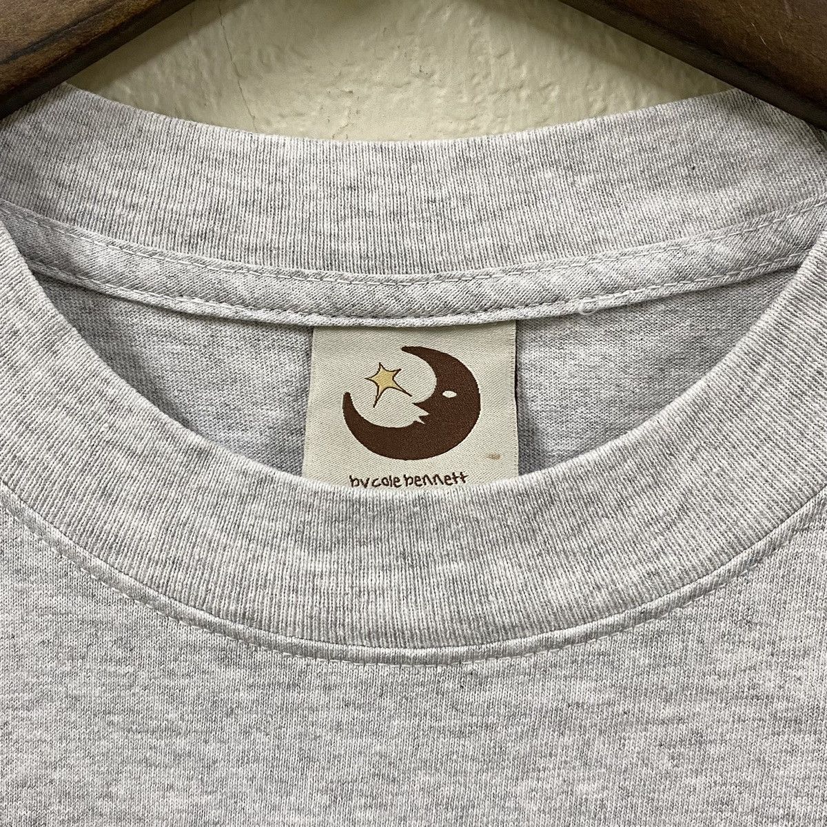 Lyrical Lemonade 2023 BY COLE BENNETT ITEM #063 SIMPSONS GREY T-SHIRT (S) Size US S / EU 44-46 / 1 - 5 Thumbnail