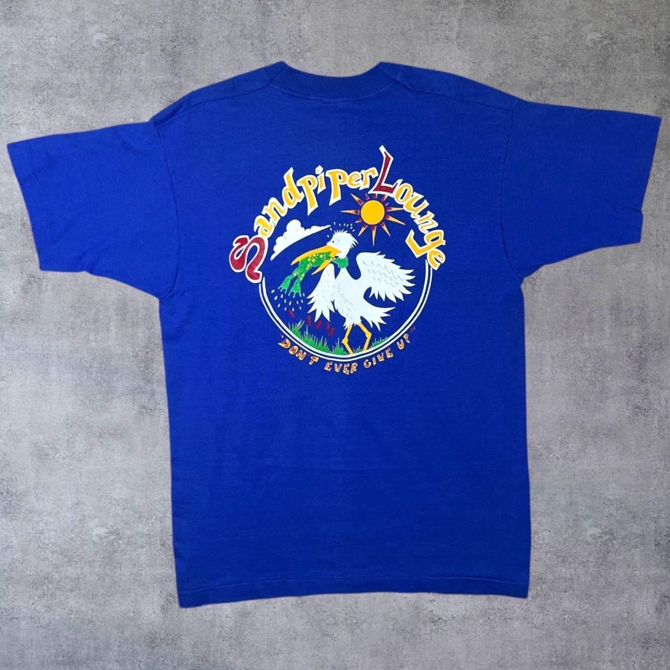 Fruit Of The Loom VINTAGE Joe Lennon's Sandpiper Lounge Flagler Beach, FL Single Stitch T-Shirt L Blue Mens Vintage 90s Graphic Pocket Tee Size US L / EU 52-54 / 3 - 2 Thumbnail