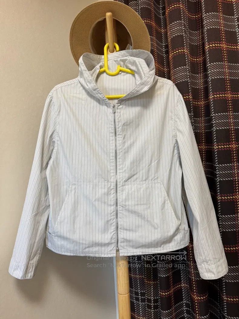 Hermes Hooded jacket. Hem with button design.