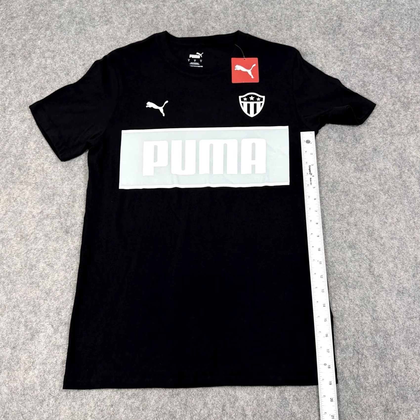 Puma Puma Soccer Shield Badge Sport Short Sleeve T-Shirt Mens Black Small Cotton Knit Shirt 38in Chest 28.5in Length Size US S / EU 44-46 / 1 - 7 Thumbnail