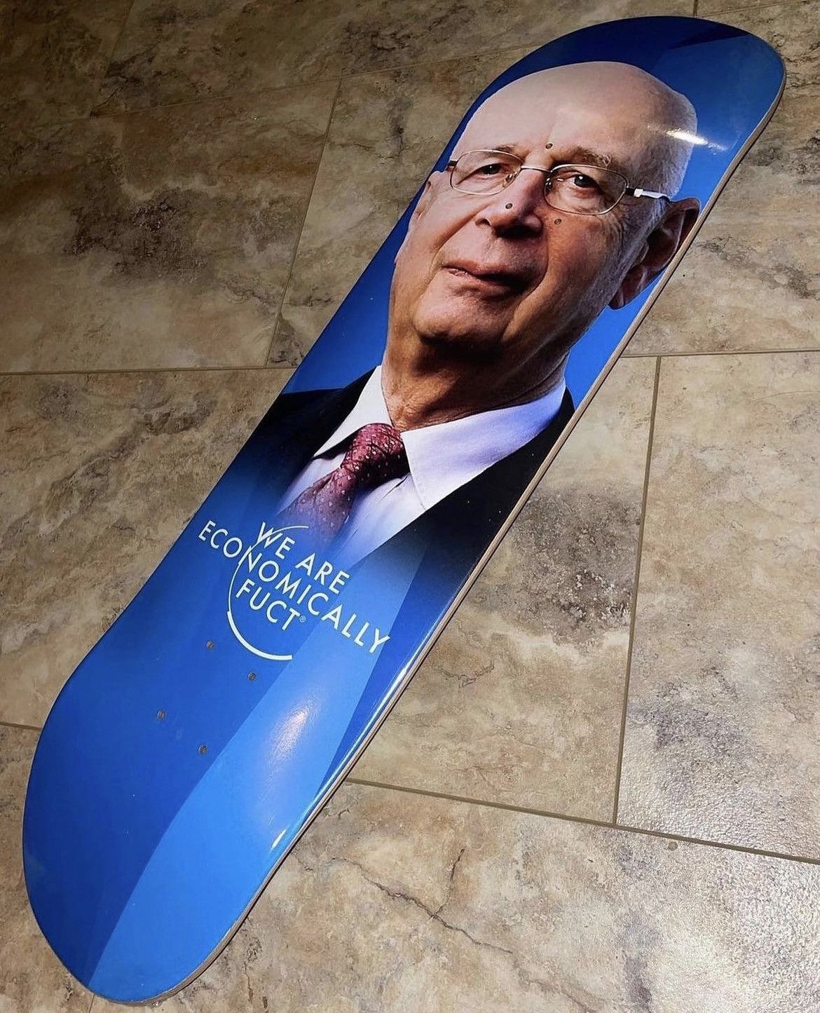 image of Fuct We Are Economically Fuct Klaus Schwab Skateboard in Blue, Men's