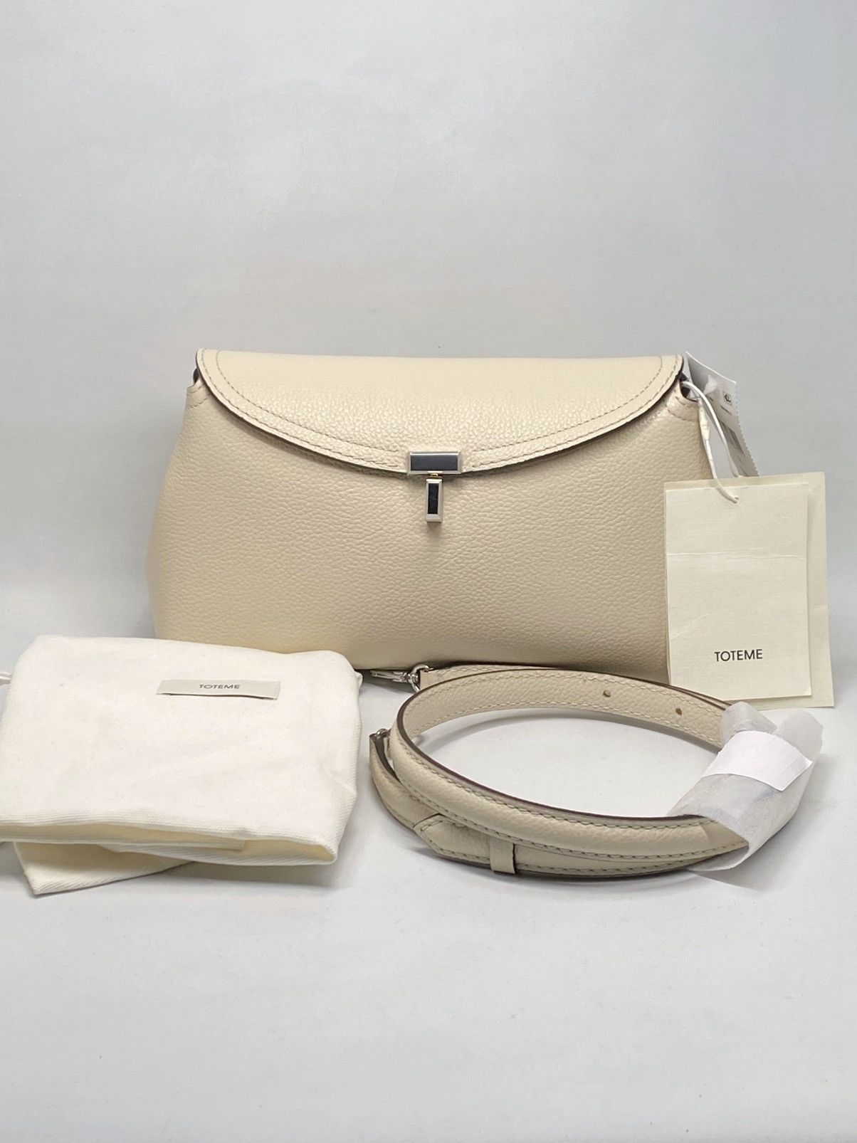 Toteme TOTEME Off-White T-Lock Grained-Leather Clutch Bag Size ONE SIZE - 1 Thumbnail