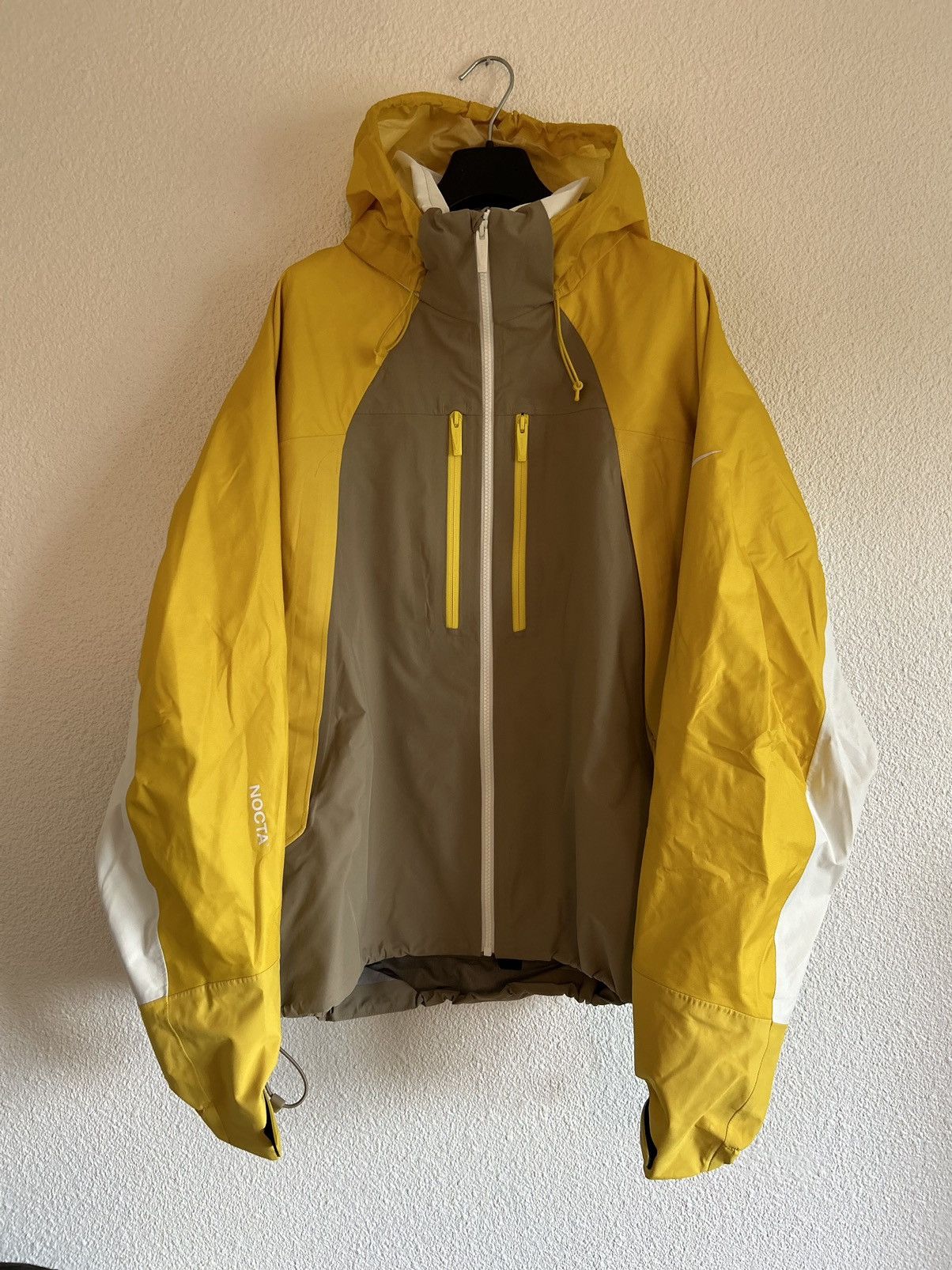 image of Nike Nocta L’Art De L’Automobile Jacket in Yellow, Men's (Size Large)