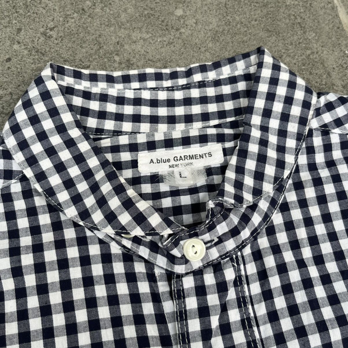 a blue garments plaid shirt button