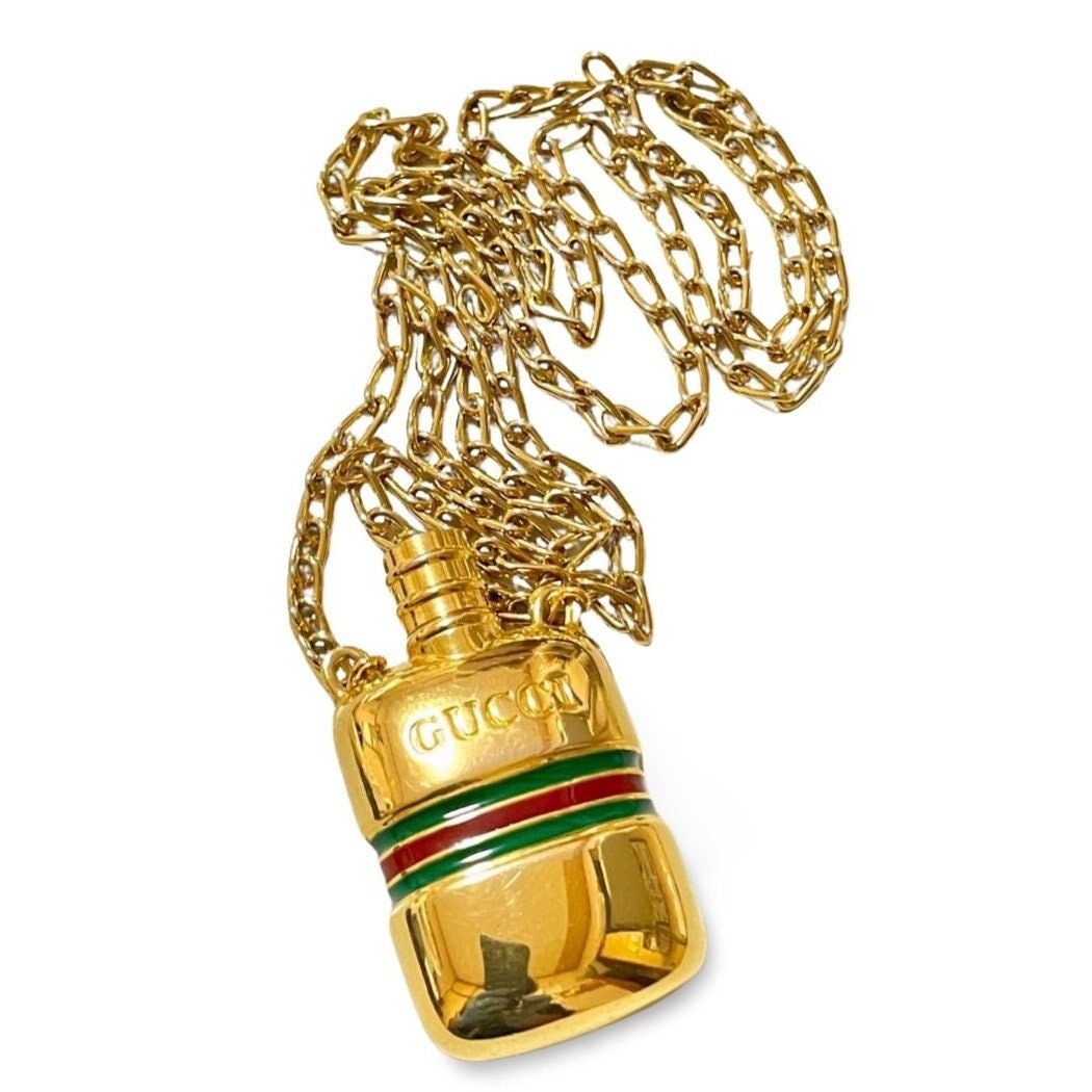 Gucci Vintage Gucci golden perfume bottle necklace with webbing Grailed