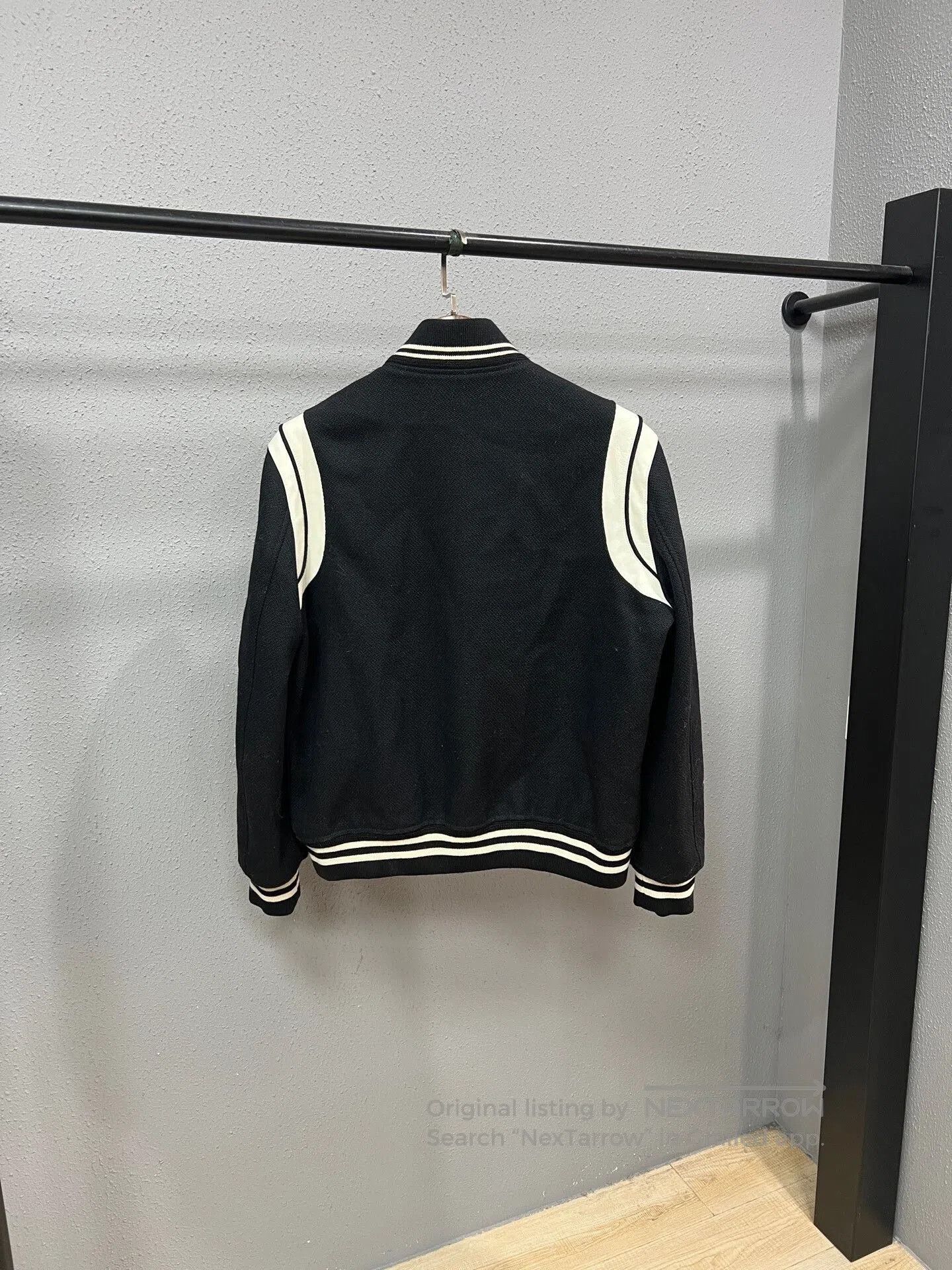 black and white baseball jacket from Saint Laurent.