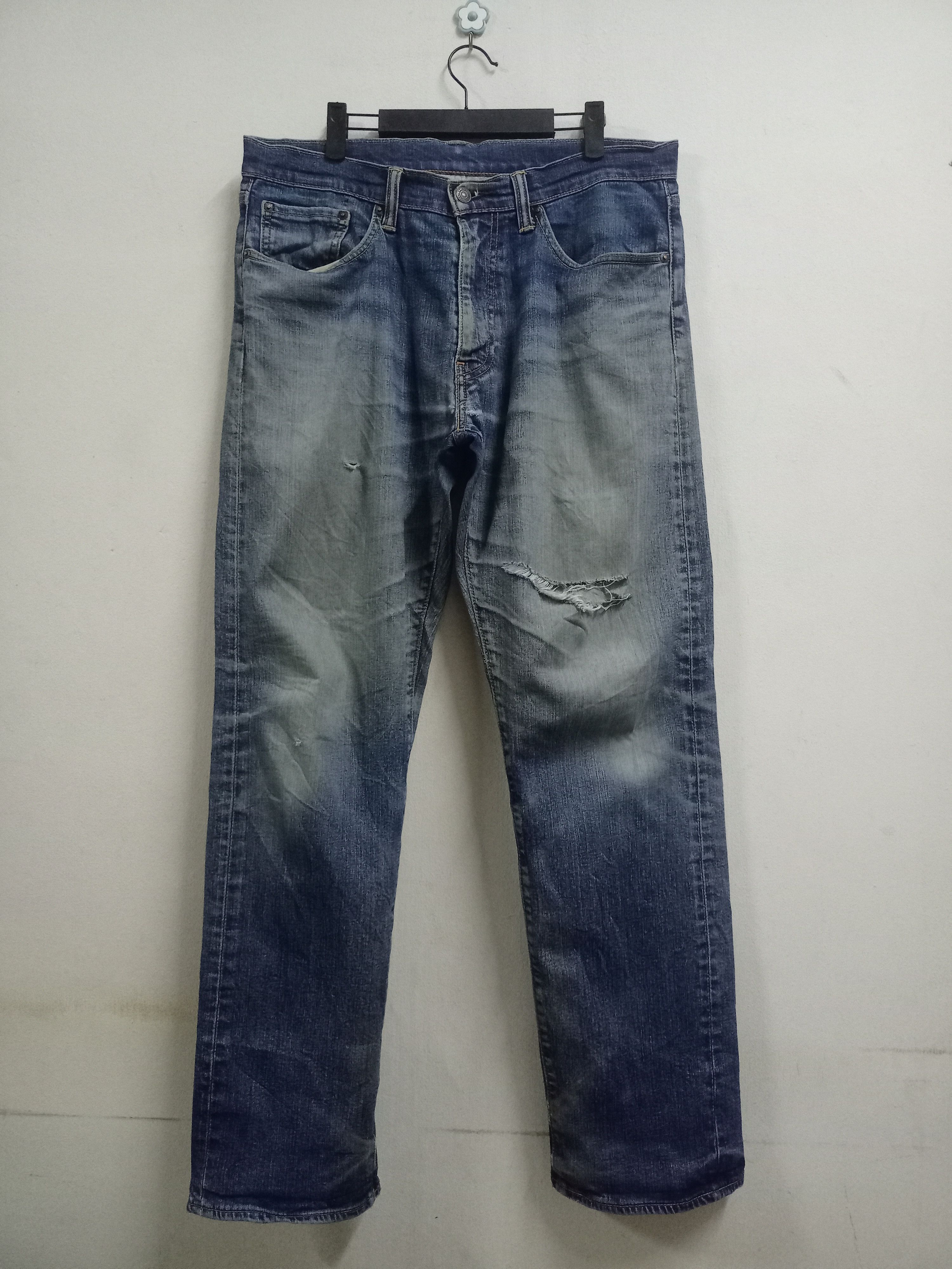 image of Vintage Levis 505 Blue Wash Distressed Ripped Baggy Jeans in Blue Denim, Men's (Size 36)