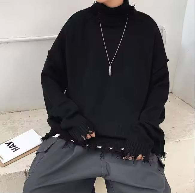ripped solid-colored high-neck sweater.