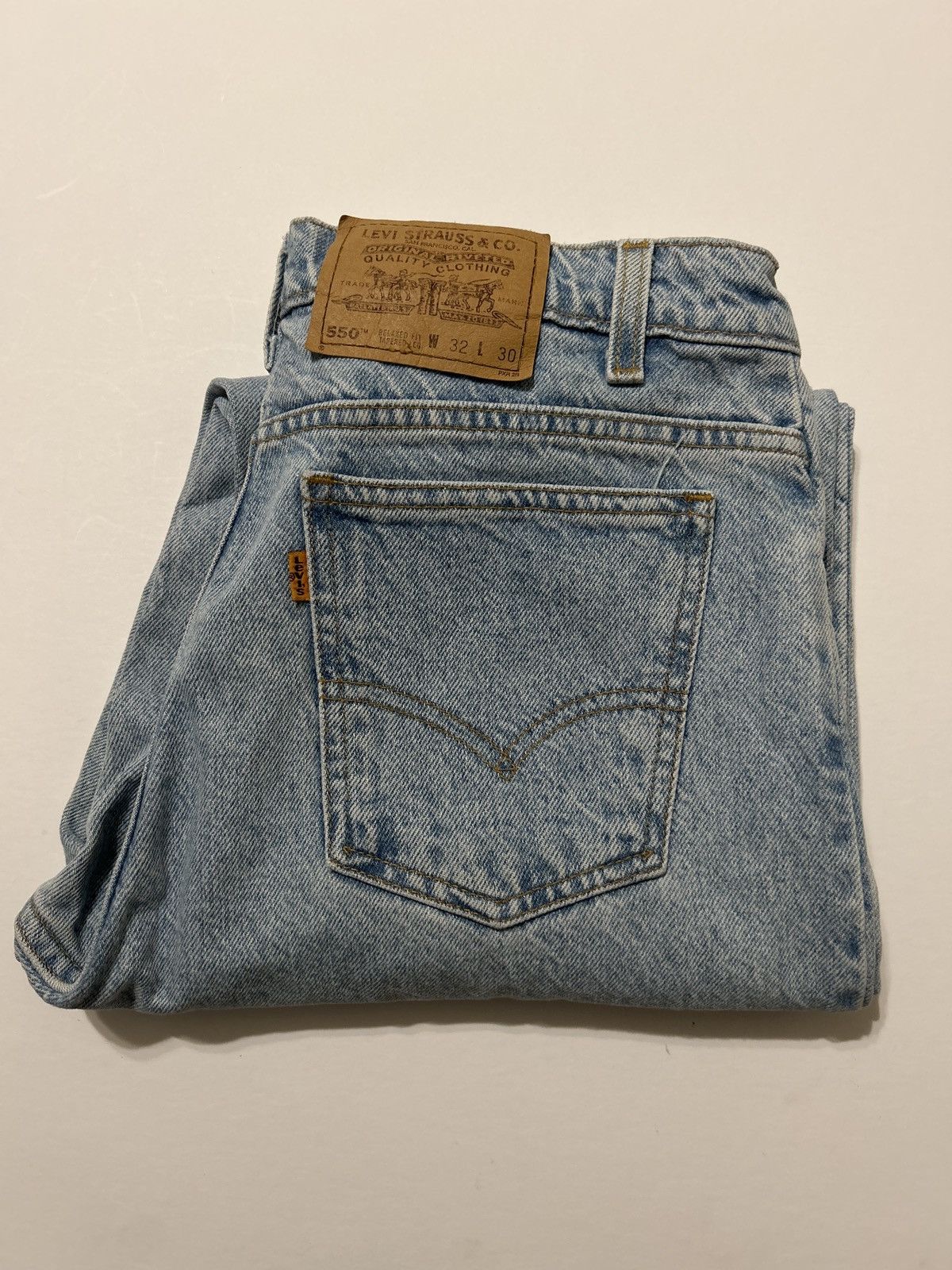 Vintage 90s Levis 550 Orange Tab Light Wash Denim Jeans