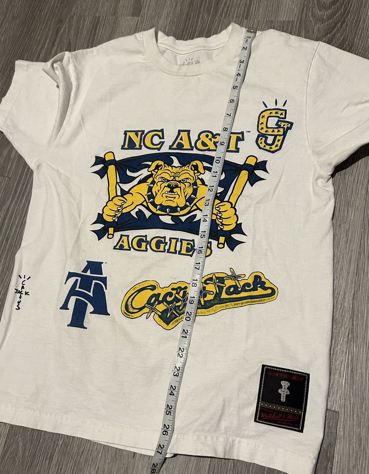 Mitchell & Ness × Travis Scott Mitchell & Ness x Cactus Jack North Carolina A&T college tee Size US M / EU 48-50 / 2 - 8 Thumbnail
