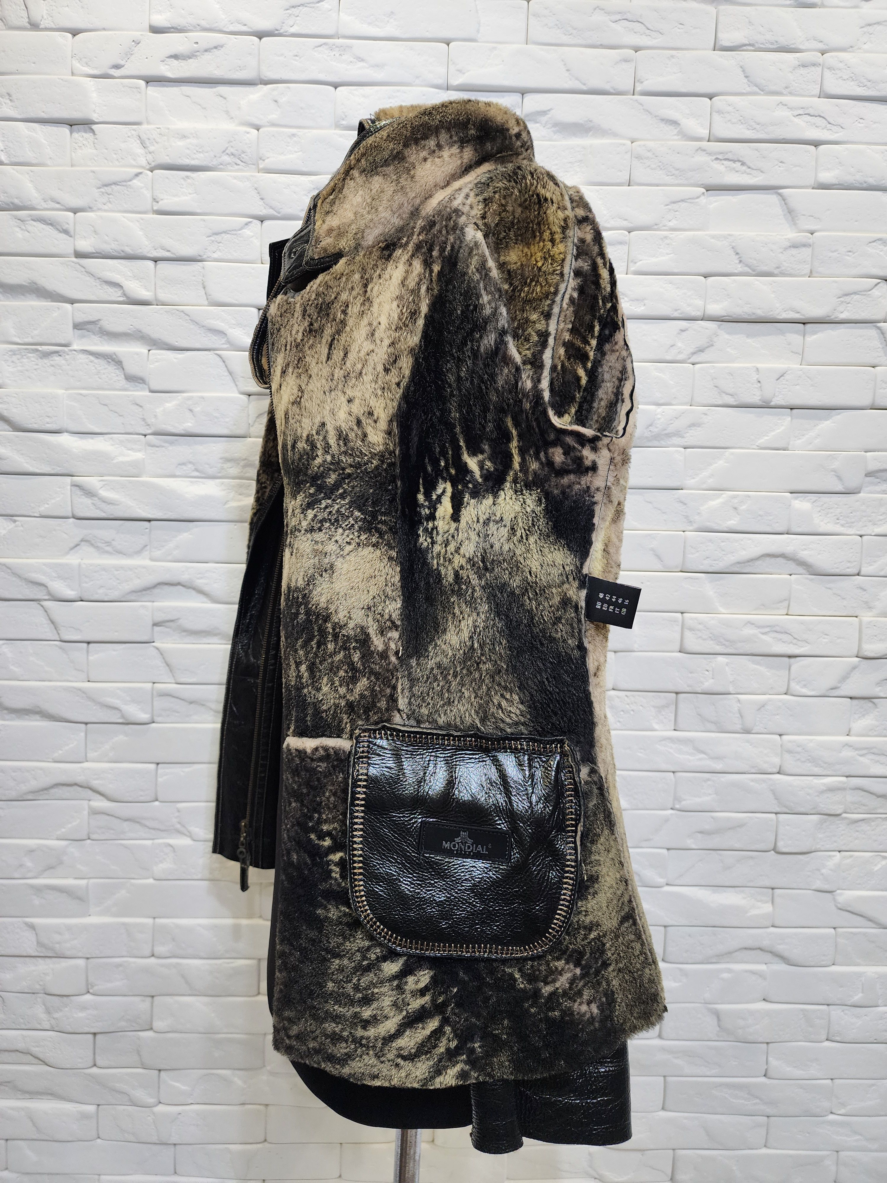 Black sheepskin coat with a metal zipper and hood.