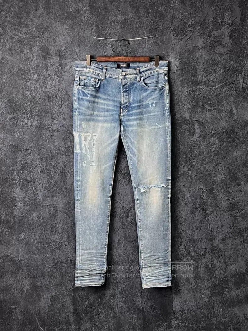 Amiri Size 33 Blue hole-in-the-elbows jeans