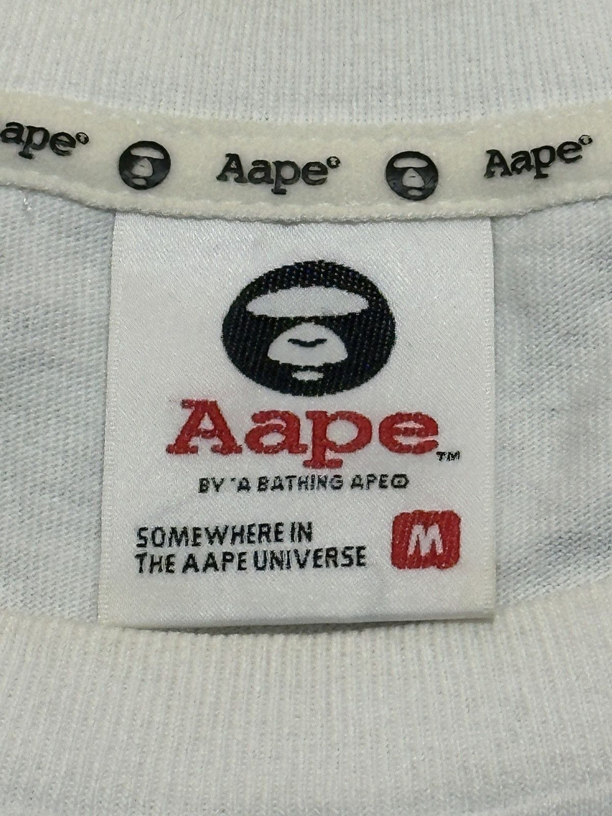 Aape AAPE by A Bathing Ape Moon Face Camo T-shirt in white. Size US M / EU 48-50 / 2 - 7 Thumbnail