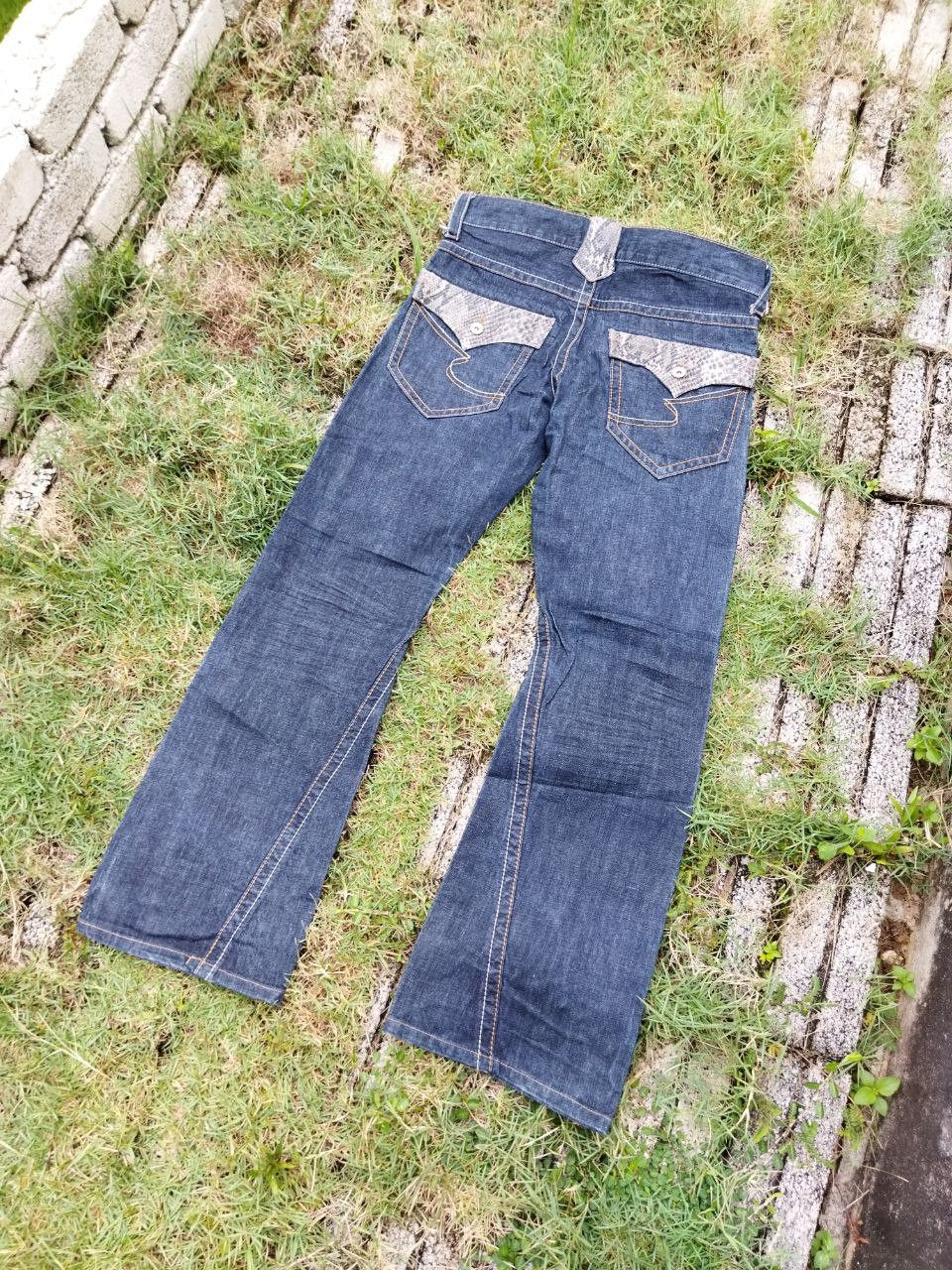 image of Archival Clothing x Vintage Flaredsemantic Design Snake Design Flared Jeans in Denim Blue (Size 35)