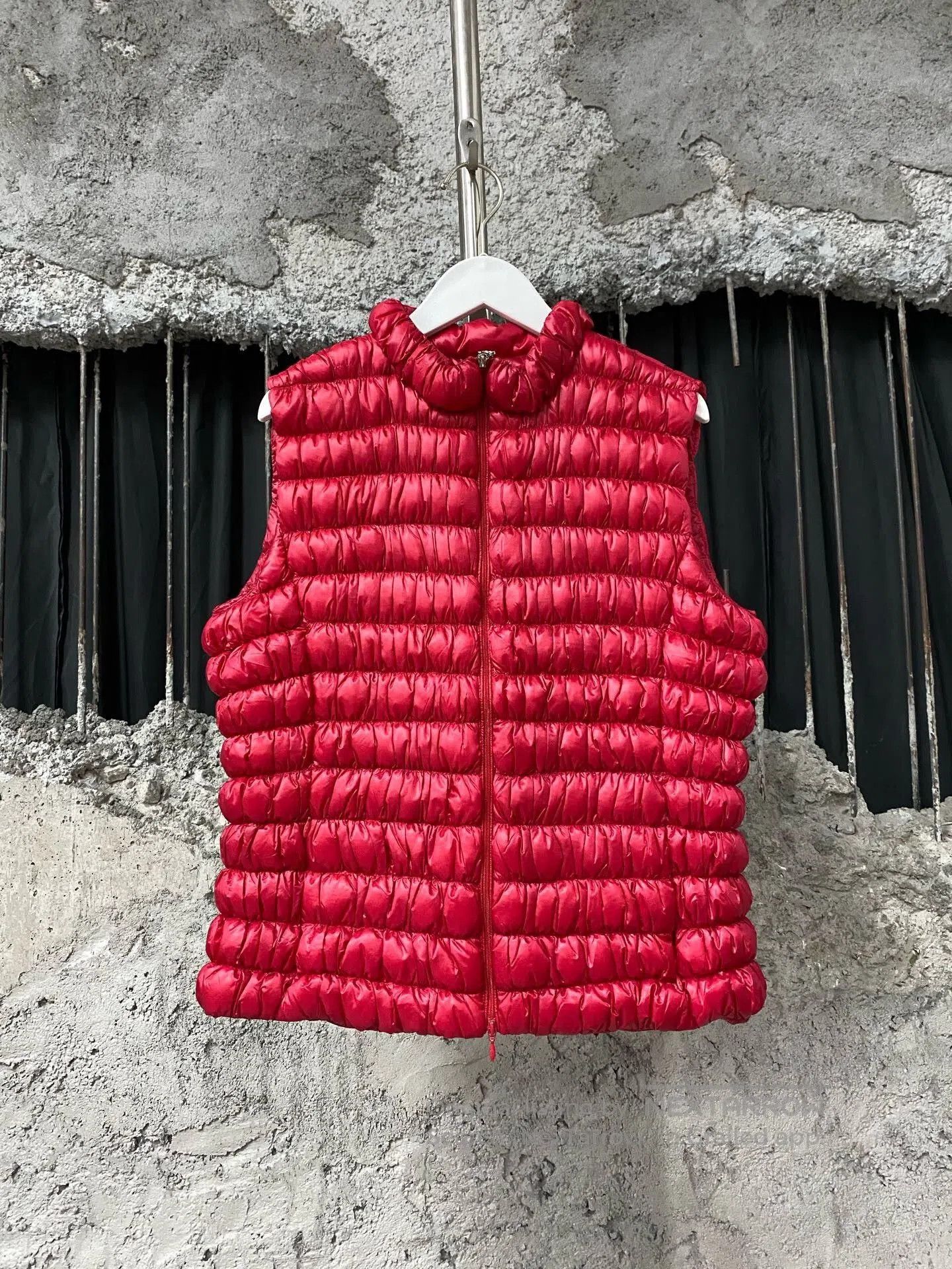 red moncler down vest for layering.