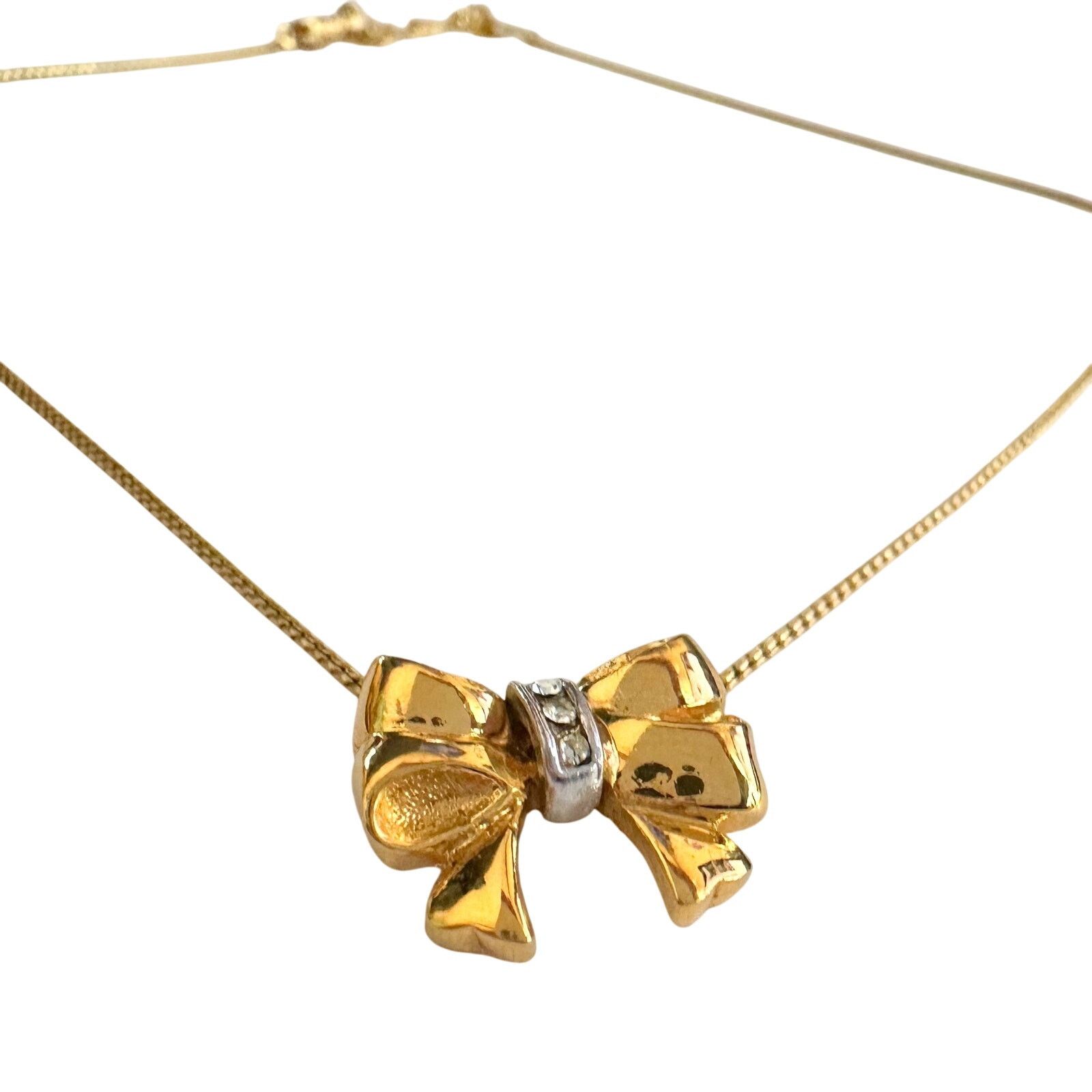 Yves Saint Laurent Yves Saint Laurent Gold and Rhinestone Bow Necklace Size ONE SIZE - 5 Thumbnail