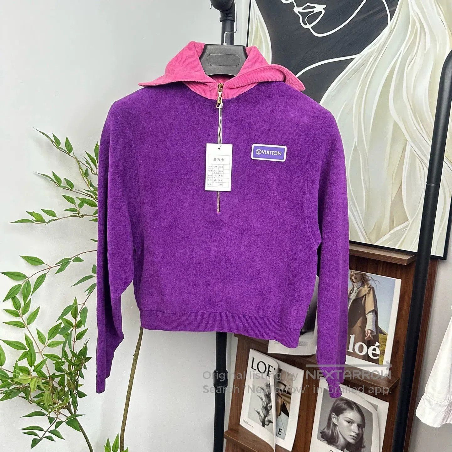 purple half-zip sweatshirt with logo.