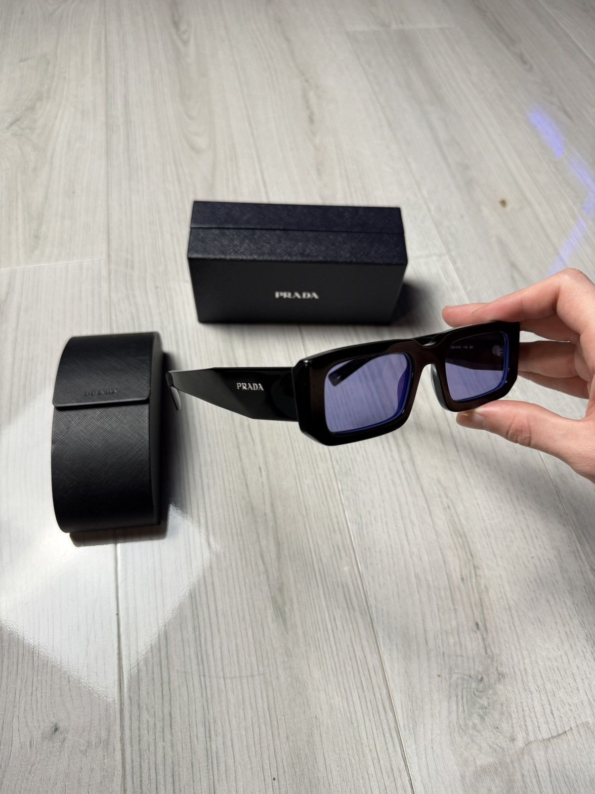 Prada Prada Sunglasses PR 06YS Black with Violet Lenses Size ONE SIZE - 1 Thumbnail