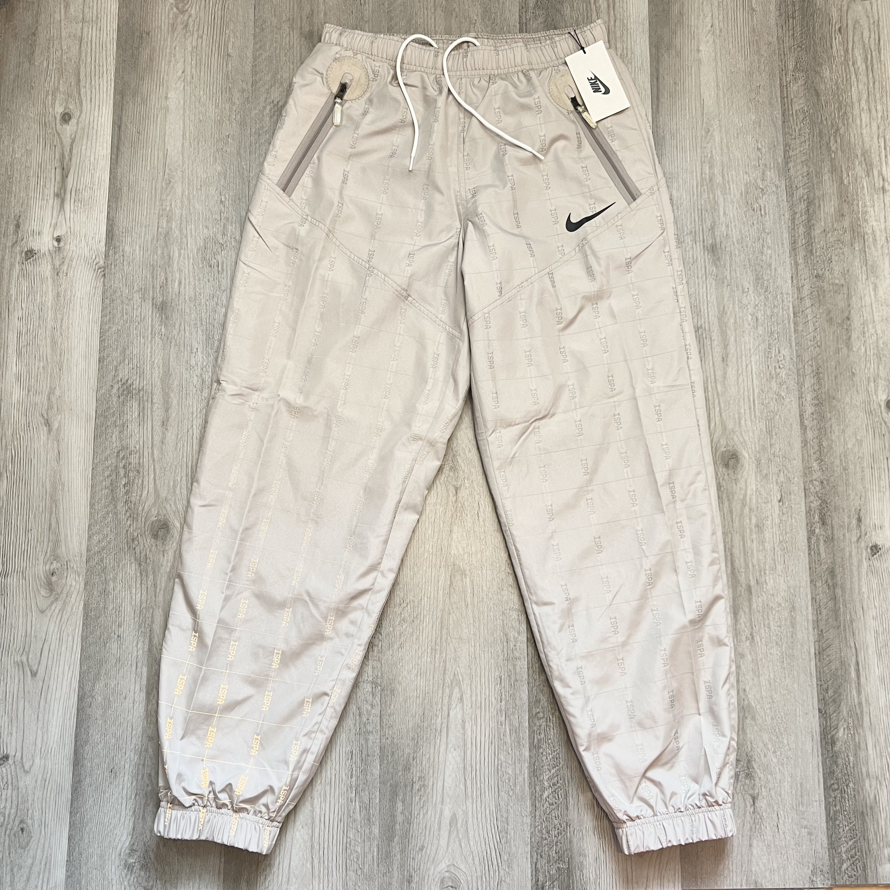 image of Nike Ispa Woven Nylon Adjustable Pants College Grey Size L, Men's
