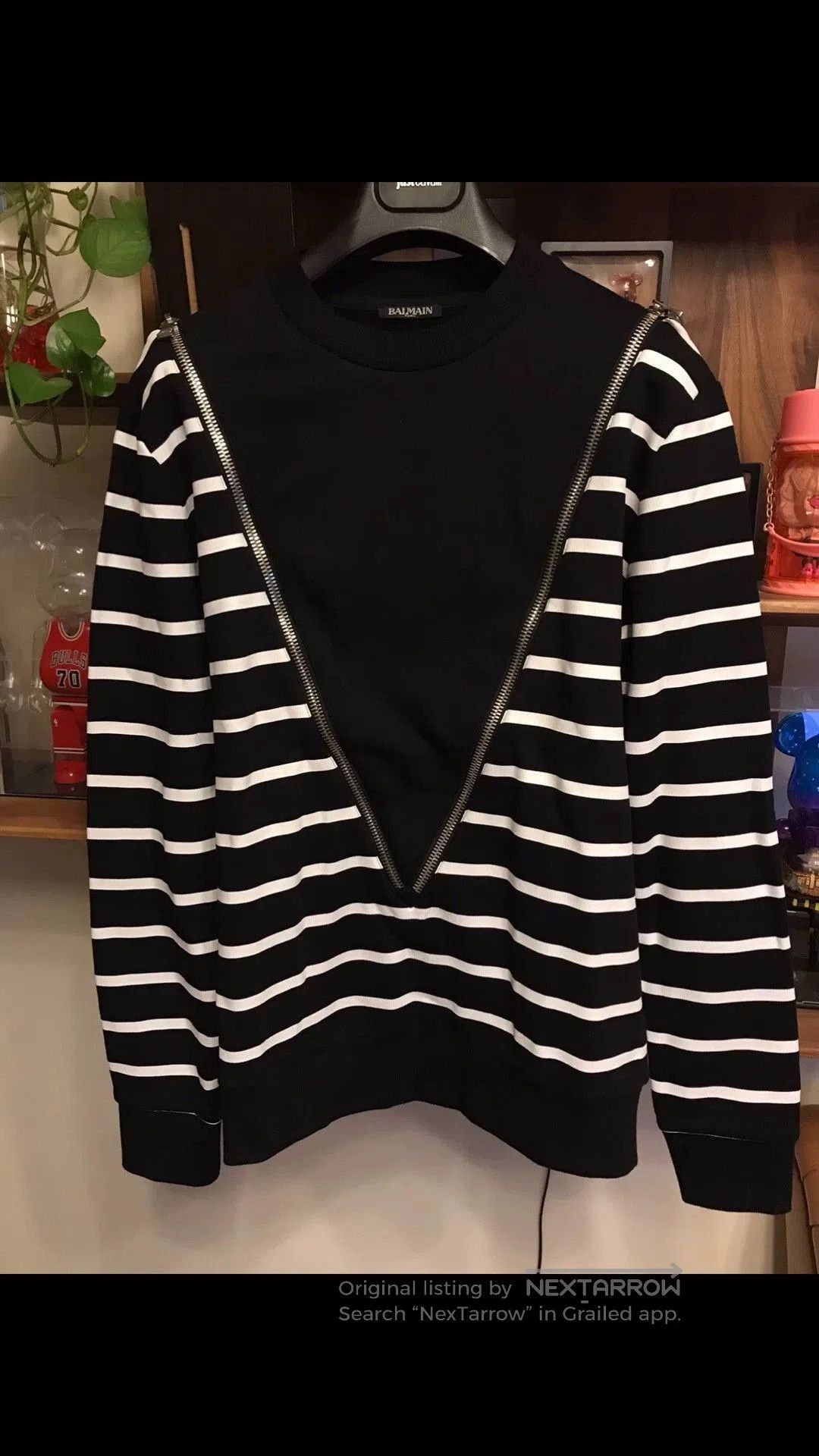 Black Striped Long Sleeve Shirt with Zipper Accents.