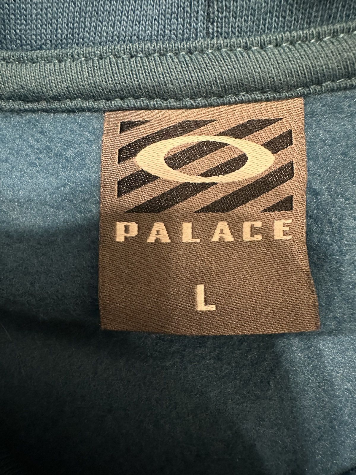 Oakley × Palace PALACE X OAKLEY HOODED SWEATSHIRT BLUE SIZE LARGE Size US L / EU 52-54 / 3 - 12 Thumbnail