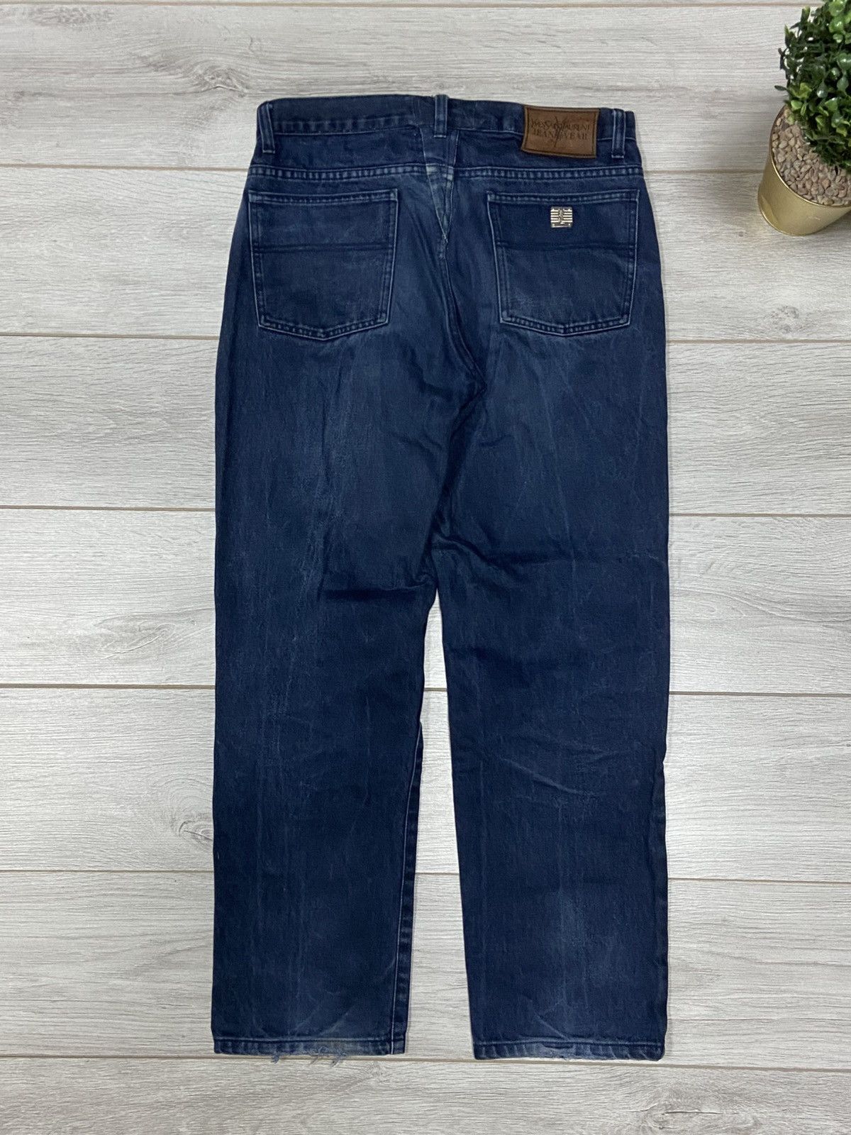 Yves Saint Laurent metallic YSL logo jeans