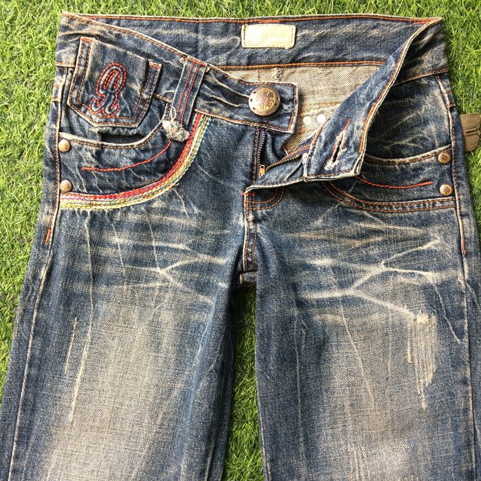 Low Rise Distressed Flared Jeans