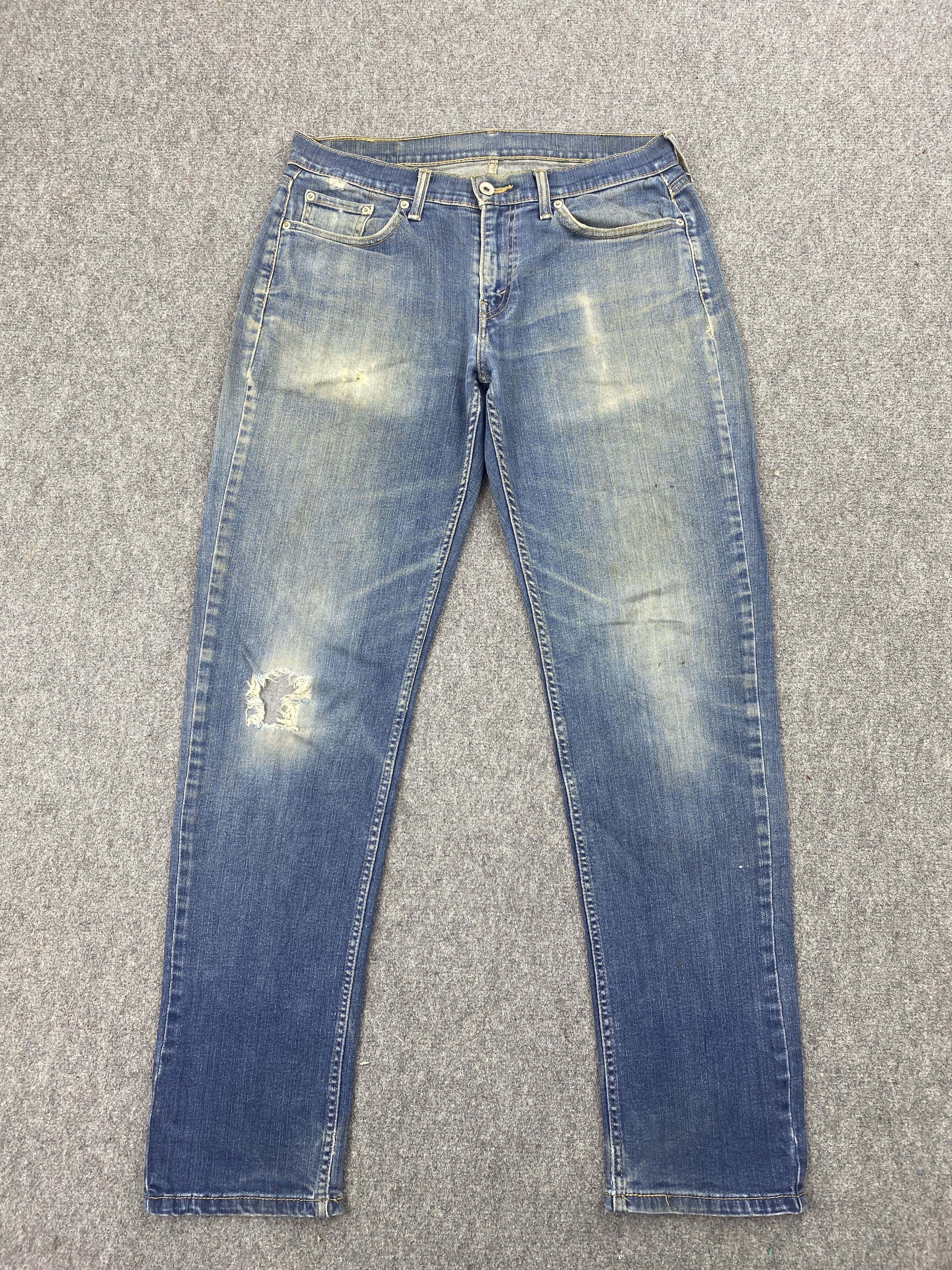Distressed Vintage Levi's 514 Faded Blue Jeans