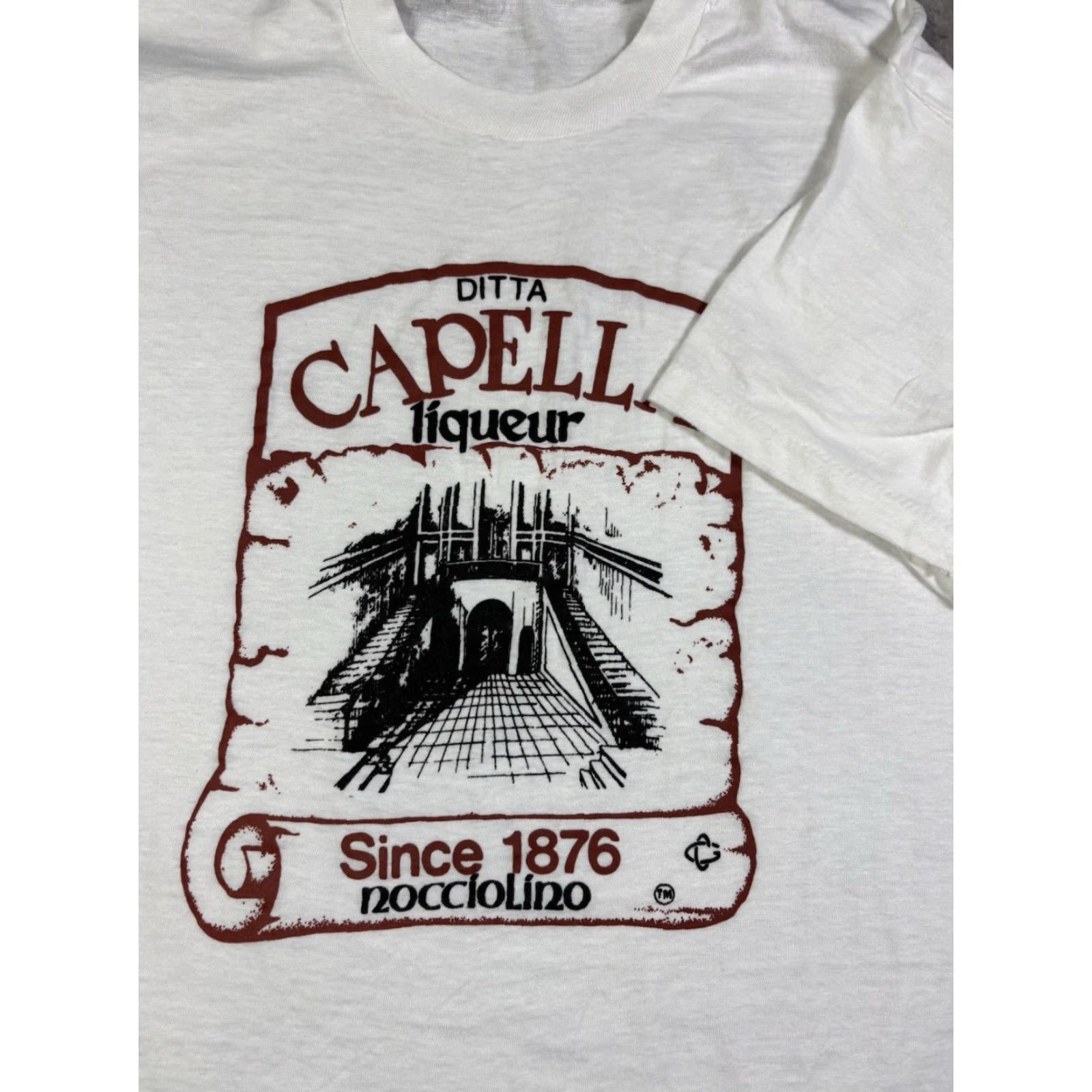 Fruit Of The Loom VINTAGE Ditta Capella Liquer Beer T Shirt Single Stitch size M Shirt Mens White Cotton Graphic Print Short Sleeve Crew Neck 80s Beer 80s Size US M / EU 48-50 / 2 - 5 Thumbnail