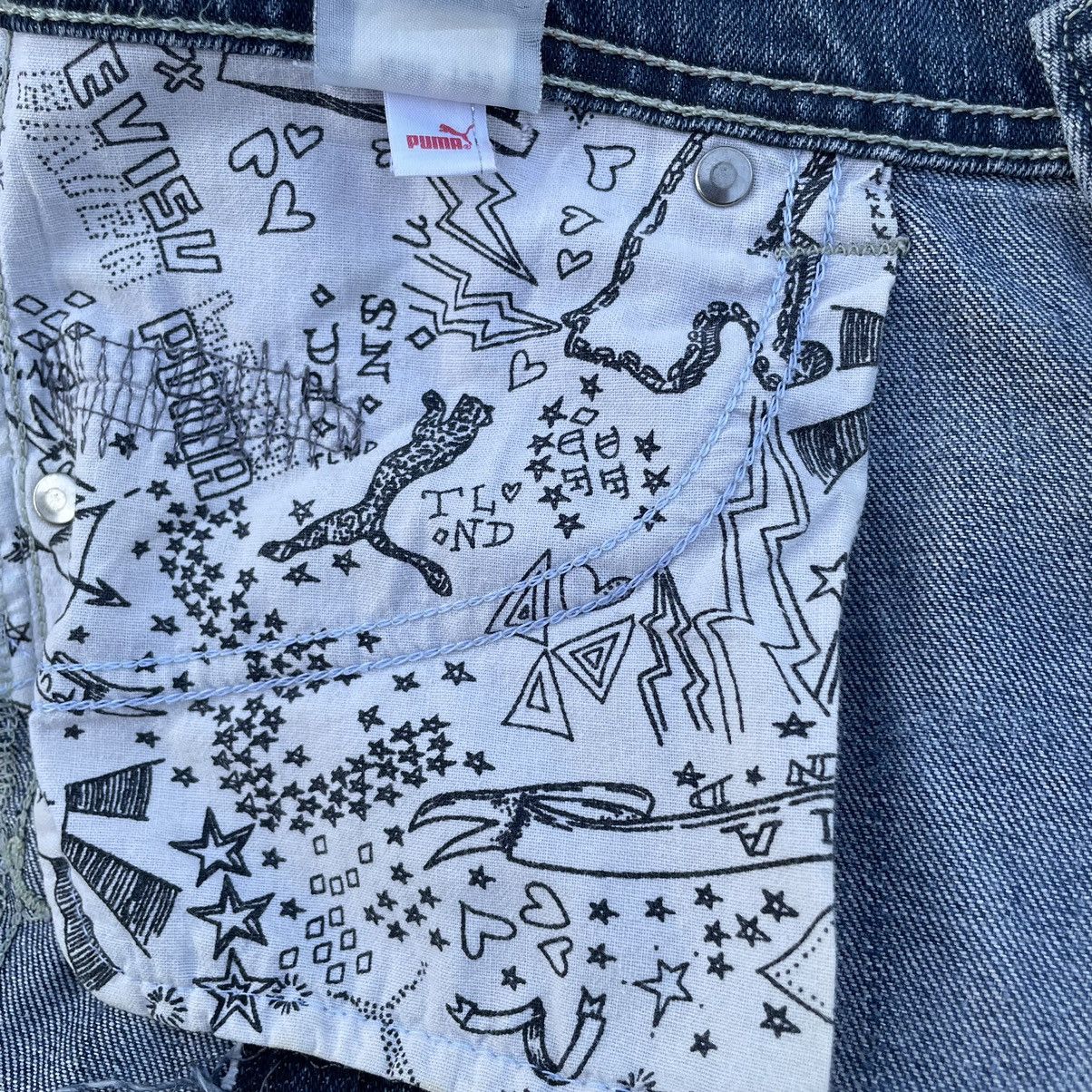VINTAGE Y2K EVISU X PUMA DISTRESSED WASHED DENIM PANTS